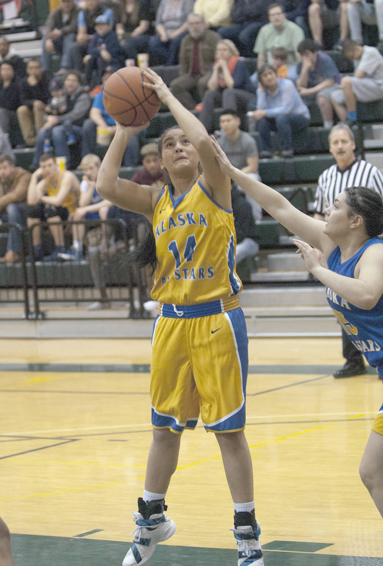 Nikiski senior Brianna Vollertsen, playing for the gold team, goes up for a shot in the Class 3A/4A girls game at the Alaska Association of Basketball Coaches All-Star Games on Saturday, April 15, 2017, at the Wells Fargo Sports Complex in Anchorage. (Photo by Matt Tunseth/Chugiak-Eagle River Star)