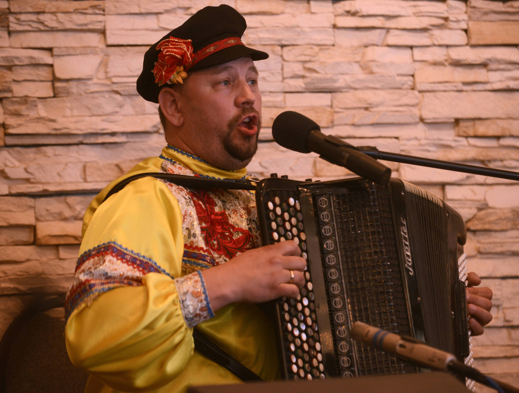 Yuri Shishkin of the Russian folk trio Moscow Nights plays the traditional Russian three-stringed balalaika, with bandmate Boris Bezrodnov on the bass version, on Friday, April 21, 2017 at Alaska Christian College near Soldotna, Alaska. With accordionist Vitali Bezrodnov, the group played for attendees at a Kenai Peninsula History Conference held on the 150th anniversary of Russia’s 1867 sale of Alaska to the United States. (Ben Boettger/Peninsula Clarion)
