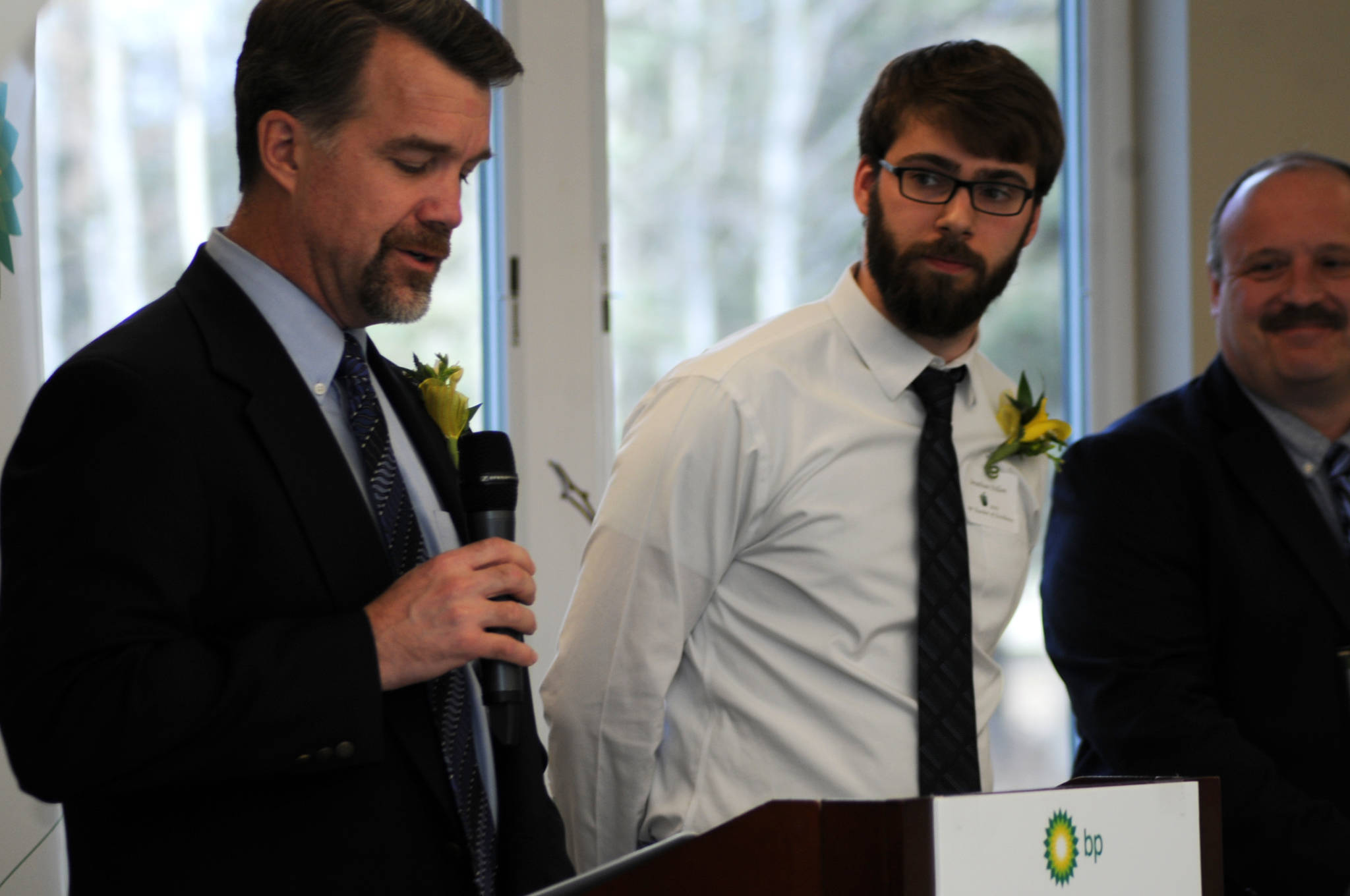 Mountain View Elementary School music teacher Jonathan Dillon (center) waits to receive a certificate recognizing him as one of the BP Teachers of Excellence for 2017 during an awards banquet on Thursday, April 27, 2017 in Soldotna, Alaska. BP recognized five teachers from around the Kenai Peninsula Borough School District for excellence in teaching with certificates, $500 gift cards and $500 donations to their schools. (Elizabeth Earl/Peninsula Clarion)
