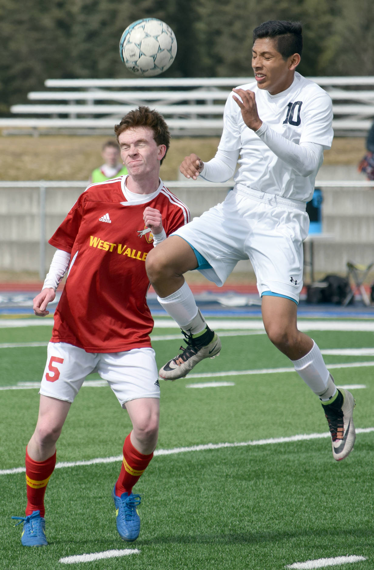 West Valley’s Sean Cadigan and Soldotna’s Alex Montague challenge for the ball Friday, April 28, 2017, at Soldotna High School. (Photo by Jeff Helminiak/Peninsula Clarion)
