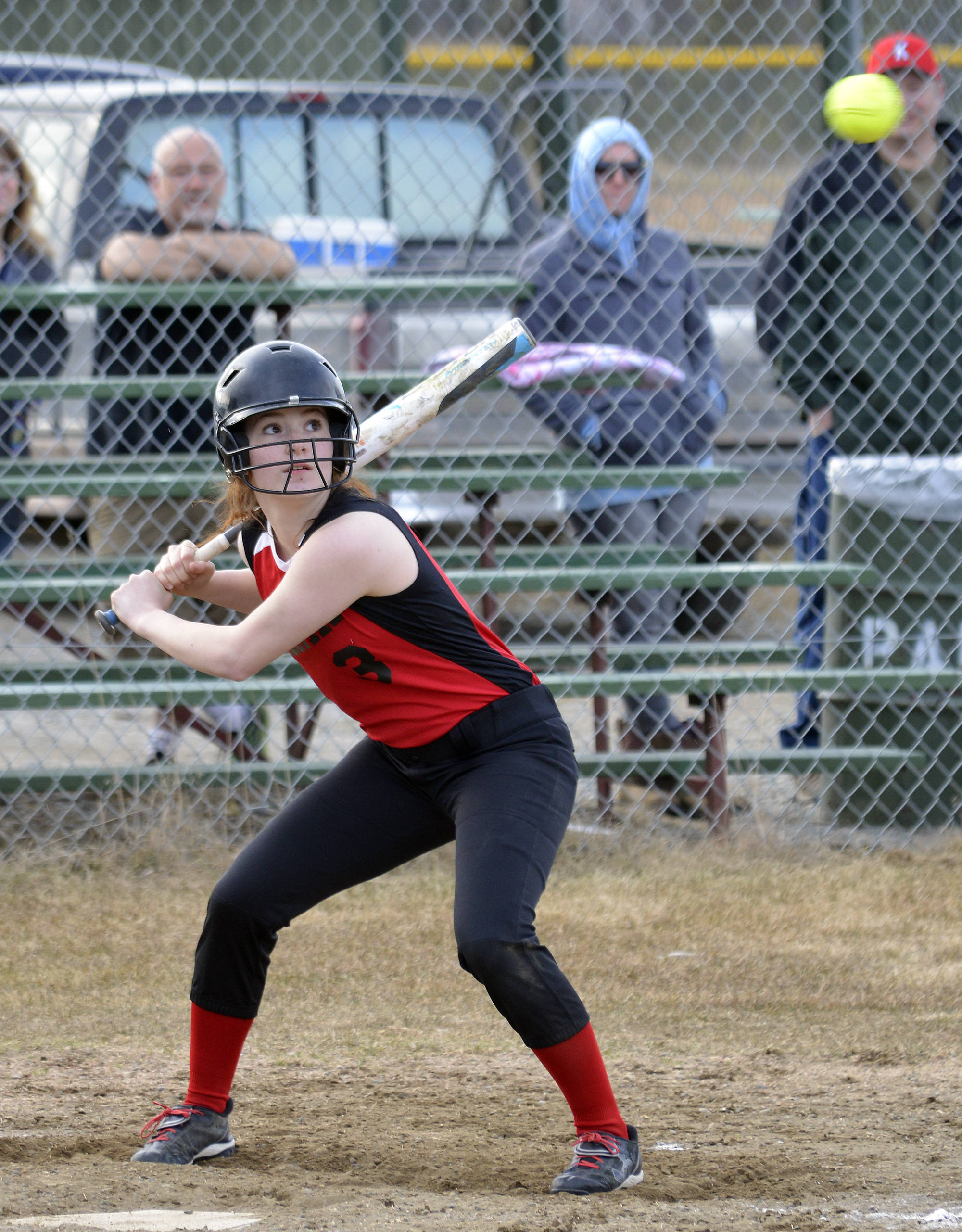 Kenai Central’s Alyssa Stanton watches a high pitch fly over her head against Palmer, Friday at Steve Shearer Memorial Ball Park in Kenai. (Photo by Joey Klecka/Peninsula Clarion)