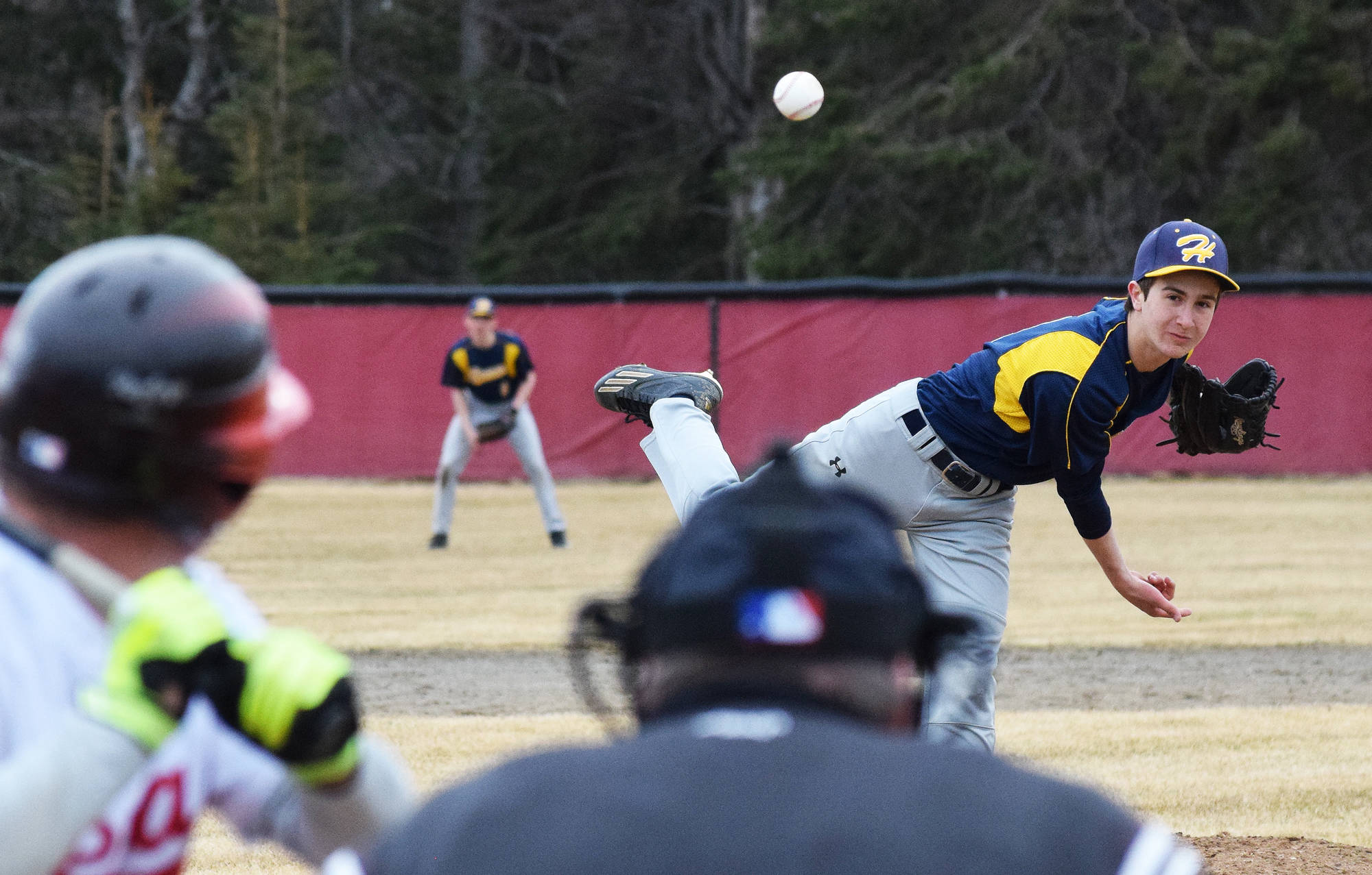Homer’s Joe Ravin offers up a pitch to a Kenai Central batter Tuesday evening at the Kenai Little League Fields. (Photo by Joey Klecka/Peninsula Clarion)