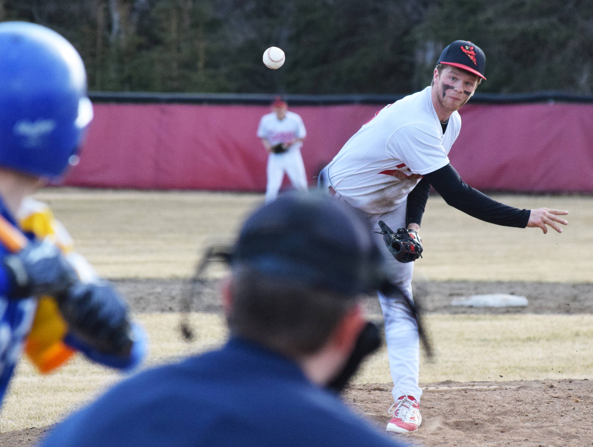 Kenai Central starting pitcher Zack Selinger offers up a pitch to a Kodiak batter Thursday night at the Kenai Little League fields. (Photo by Joey Klecka/Peninsula Clarion)