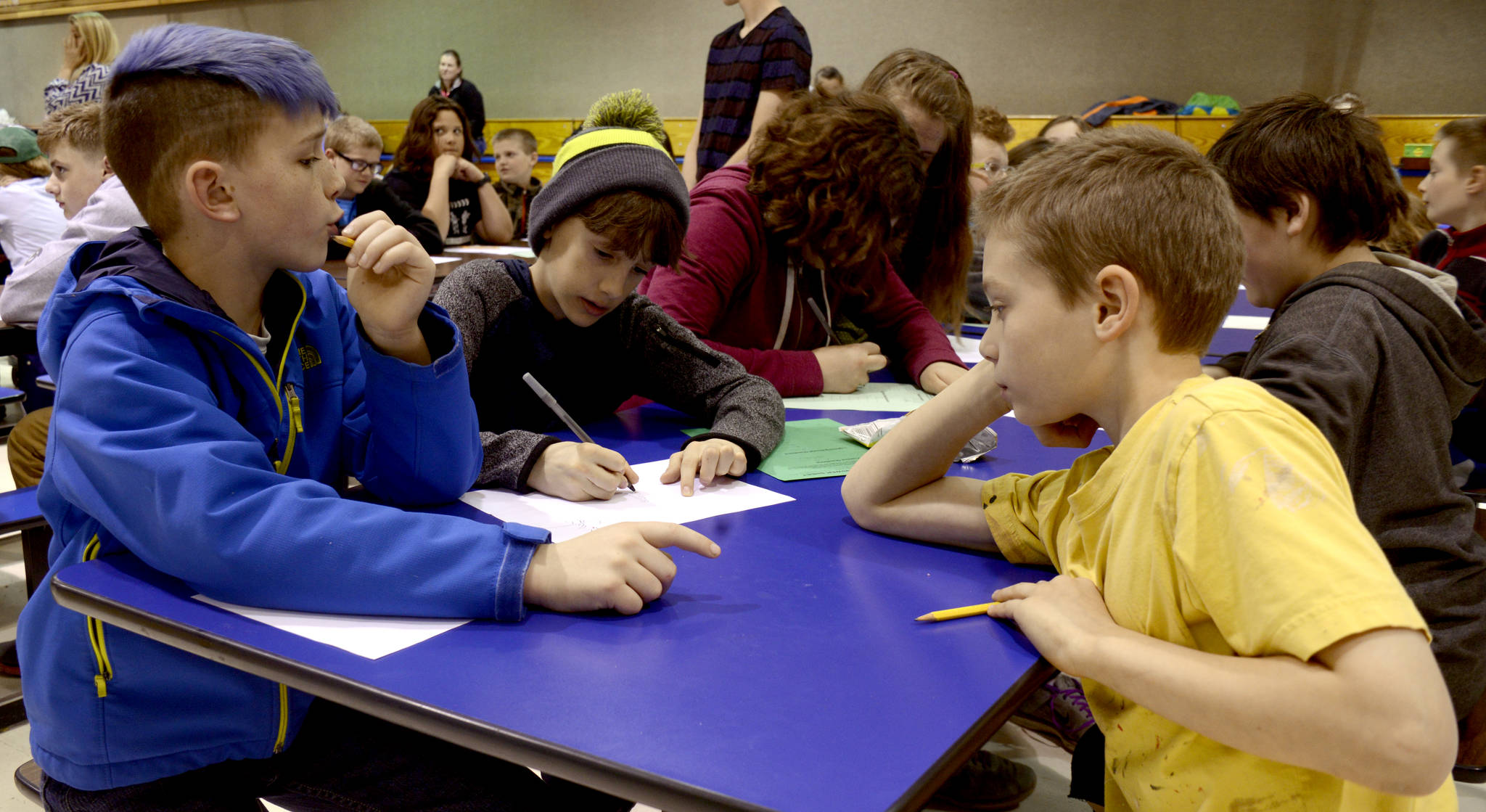 Terry Yerly, left, and Brenden Jones, fourth-graders from Tustumena Elementary School, race against the clock during lightning round of the elementary school math meet at Mountain View Elementary on Thursday, May 4, 2017 in Kenai, Alaska. The meet brought together 120 fourth, fifth and sixth-graders from across the Kenai Peninsula Borough School District. (Kat Sorensen/Peninsula Clarion)