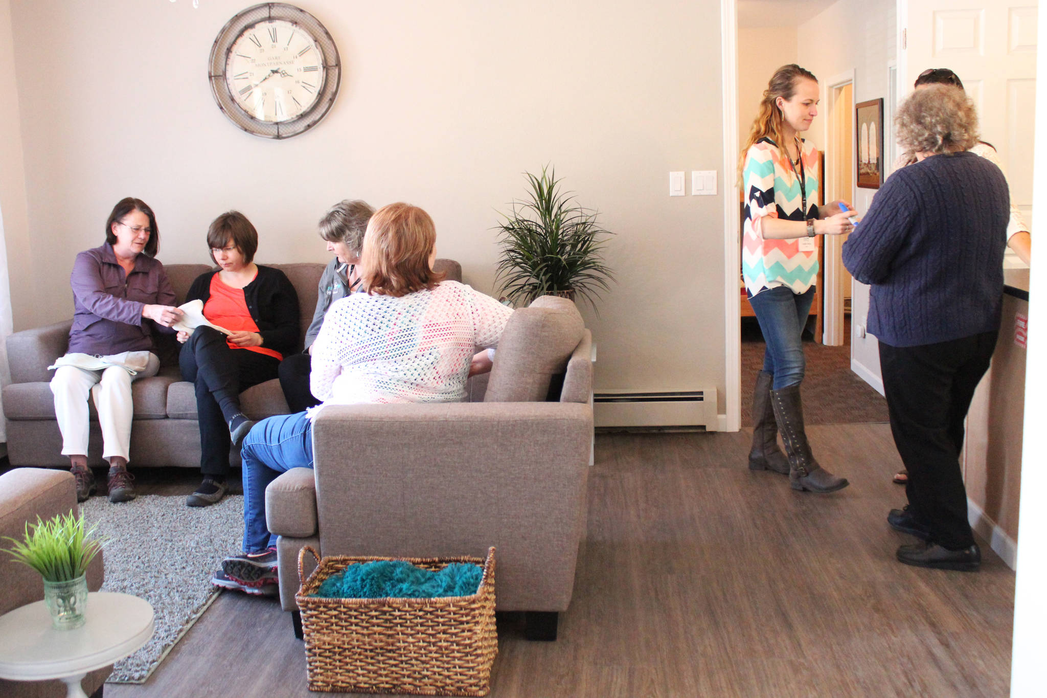 Visitors mingle during an open house for Freedom House, a faith-based sober living home, held Friday, May 5, 2017 in Soldotna, Alaska. The home will accept up to eight women at a time into a nine-month program to help in their recovery. (Megan Pacer/Peninsula Clarion)