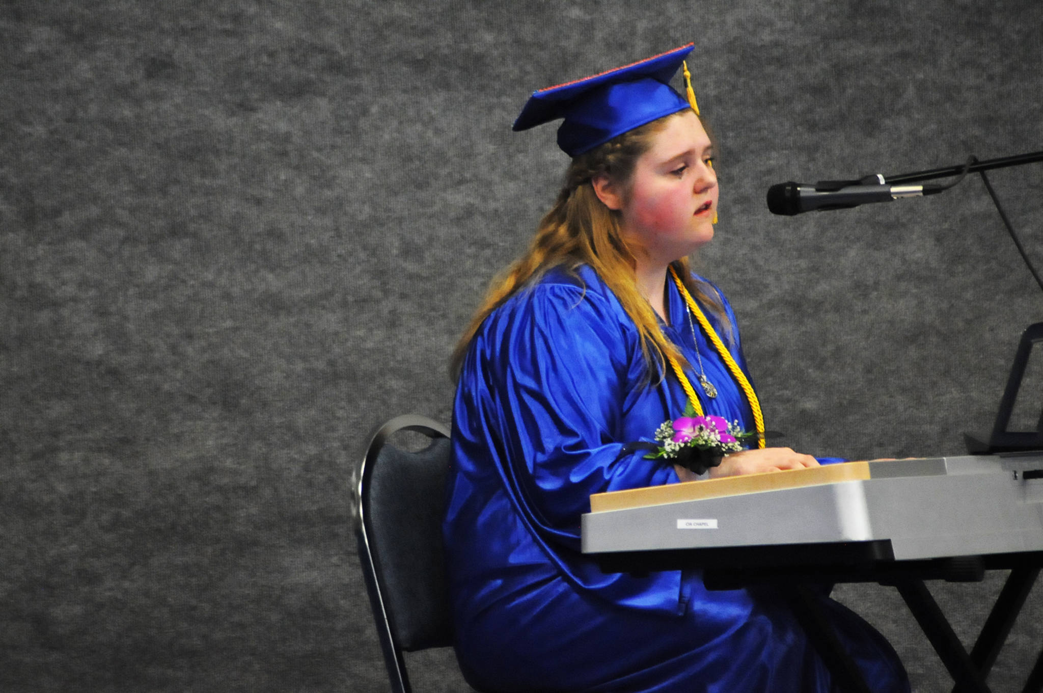 Brooke Kent, a Cook Inlet Academy graduate, plays and sings the song “Soar” by Meredith Andrews at the school’s graduation ceremony Sunday, May 7, 2017 in Soldotna, Alaska. (Elizabeth Earl/Peninsula Clarion)  Brooke Kent, a Cook Inlet Academy graduate, plays and sings the song “Soar” by Meredith Andrews at the school’s graduation ceremony Sunday in Soldotna. (Elizabeth Earl/Peninsula Clarion)