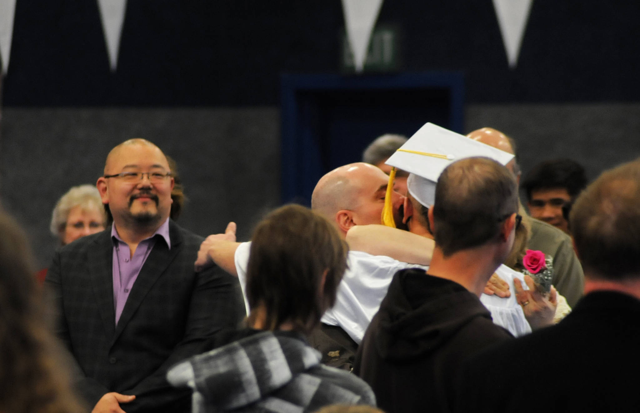 Cook Inlet Academy graduate Dalton Warren embraces his parents as he processed into the school’s graduation ceremony Sunday, May 7, 2017 in Soldotna, Alaska. (Elizabeth Earl/Peninsula Clarion)  Cook Inlet Academy graduate Dalton Warren embraces his parents as he processed into the school’s graduation ceremony Sunday in Soldotna. (Elizabeth Earl/Peninsula Clarion)