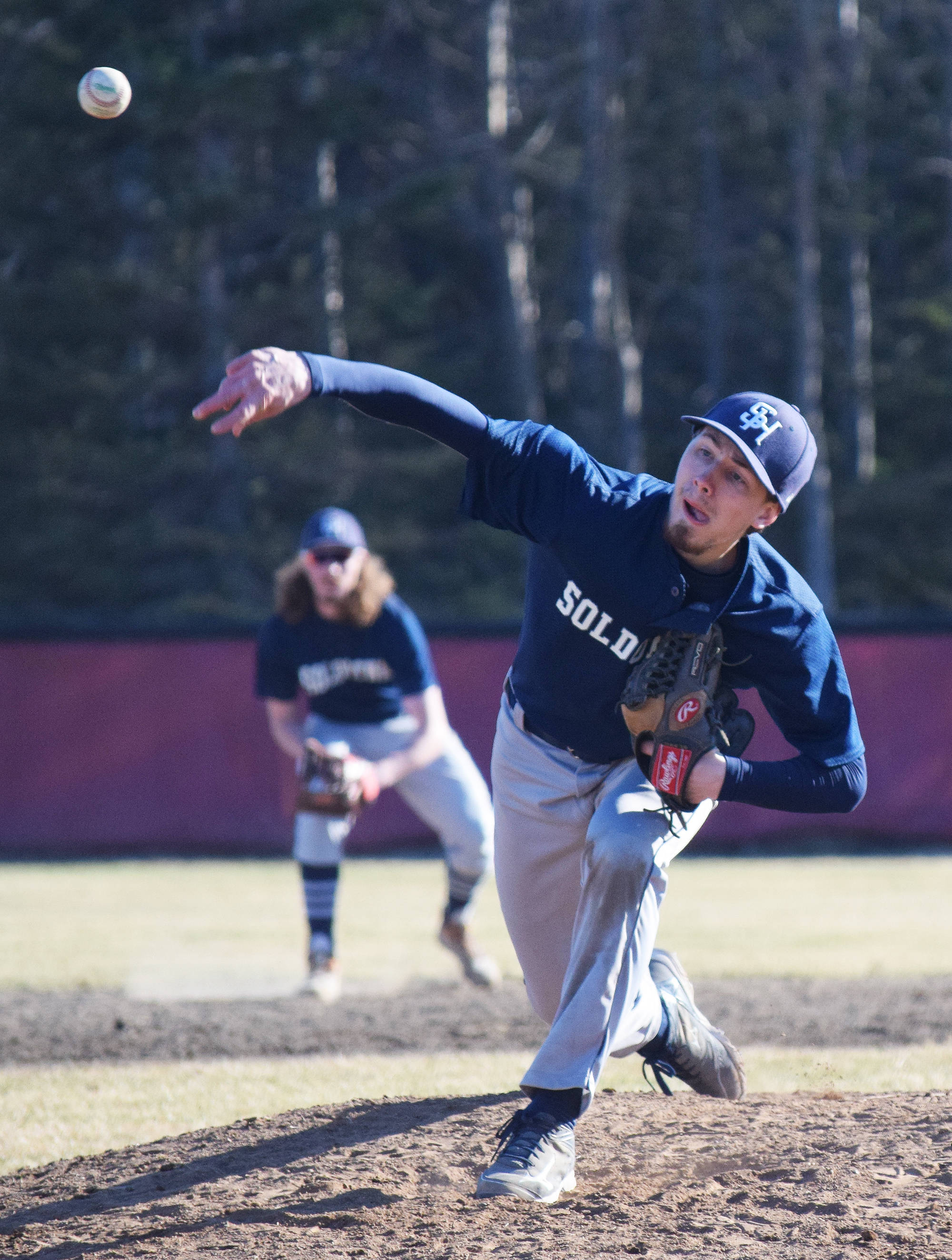 Soldotna starter Caleb Spence delivers a pitch to a Kenai Central batter Wednesday evening at the Kenai Little League Fields. (Photo by Joey Klecka/Peninsula Clarion)