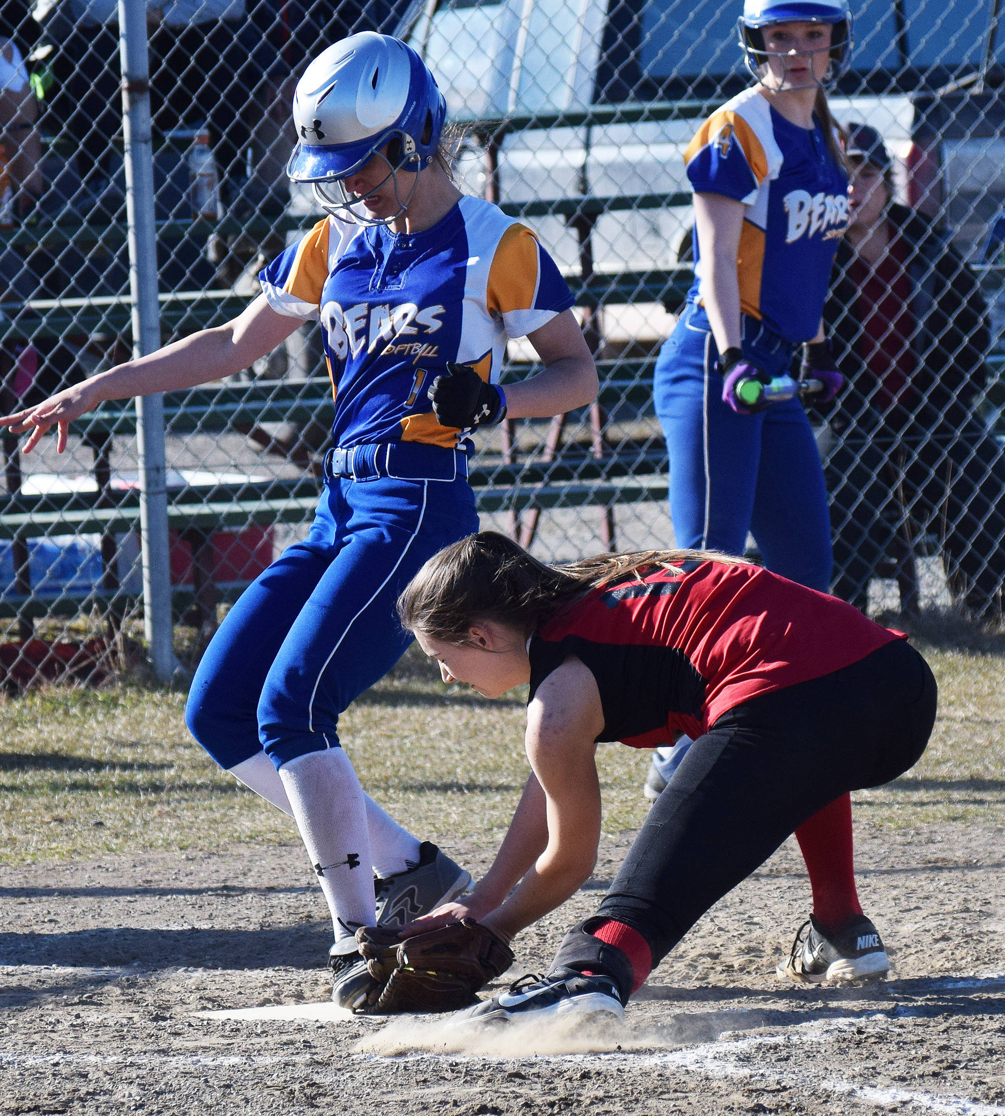 Kenai Central pitcher Cierra King (right) attempts to tag out Kodiak baserunner Cameron Bolen on Thursday, May 11, 2017, evening at Steve Shearer Memorial Ball Park in Kenai. (Photo by Joey Klecka/Peninsula Clarion)