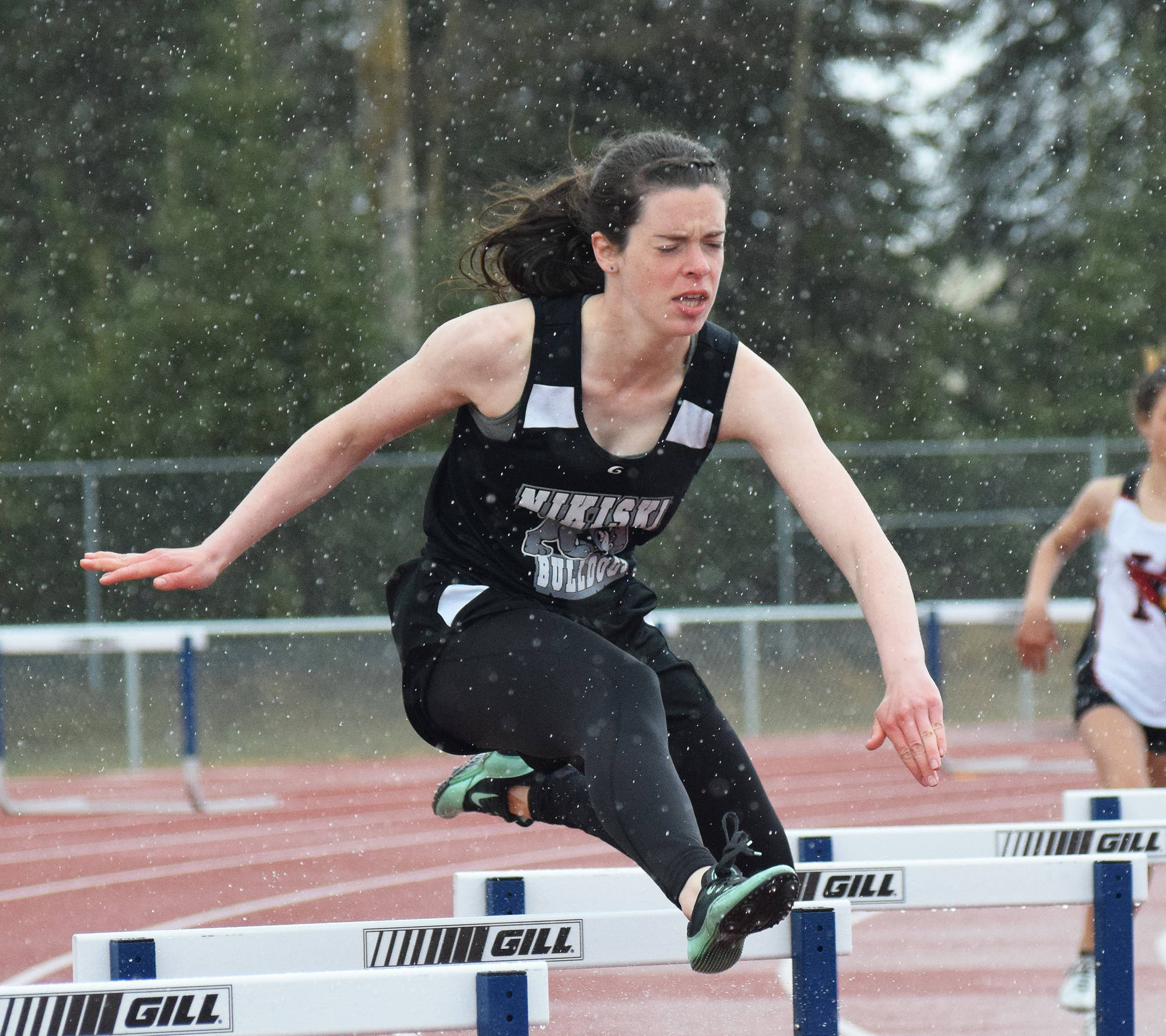 Nikiski senior Crystal Epperheimer leaps a barrier in the girls 300-meter hurdles race Saturday afternoon at the Kenai Peninsula Borough track and field championships at Justin Maile Field in Soldotna. (Photo by Joey Klecka/Peninsula Clarion)