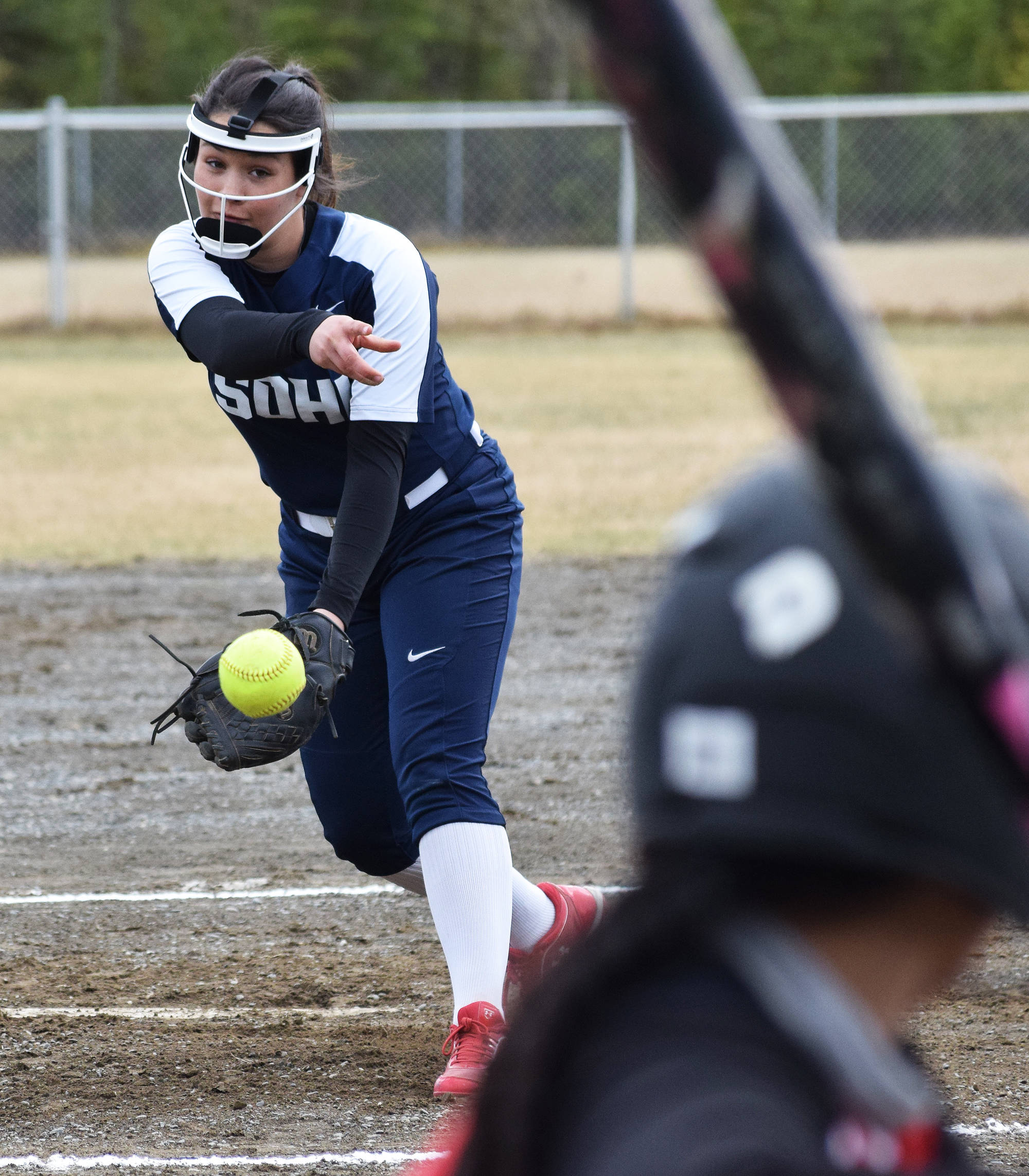 Soldotna starter Danielle Hills delivers a pitch to Kenai Central’s Patricia Catacutan, Wednesday at the Soldotna Little League Fields. (Photo by Joey Klecka/Peninsula Clarion)