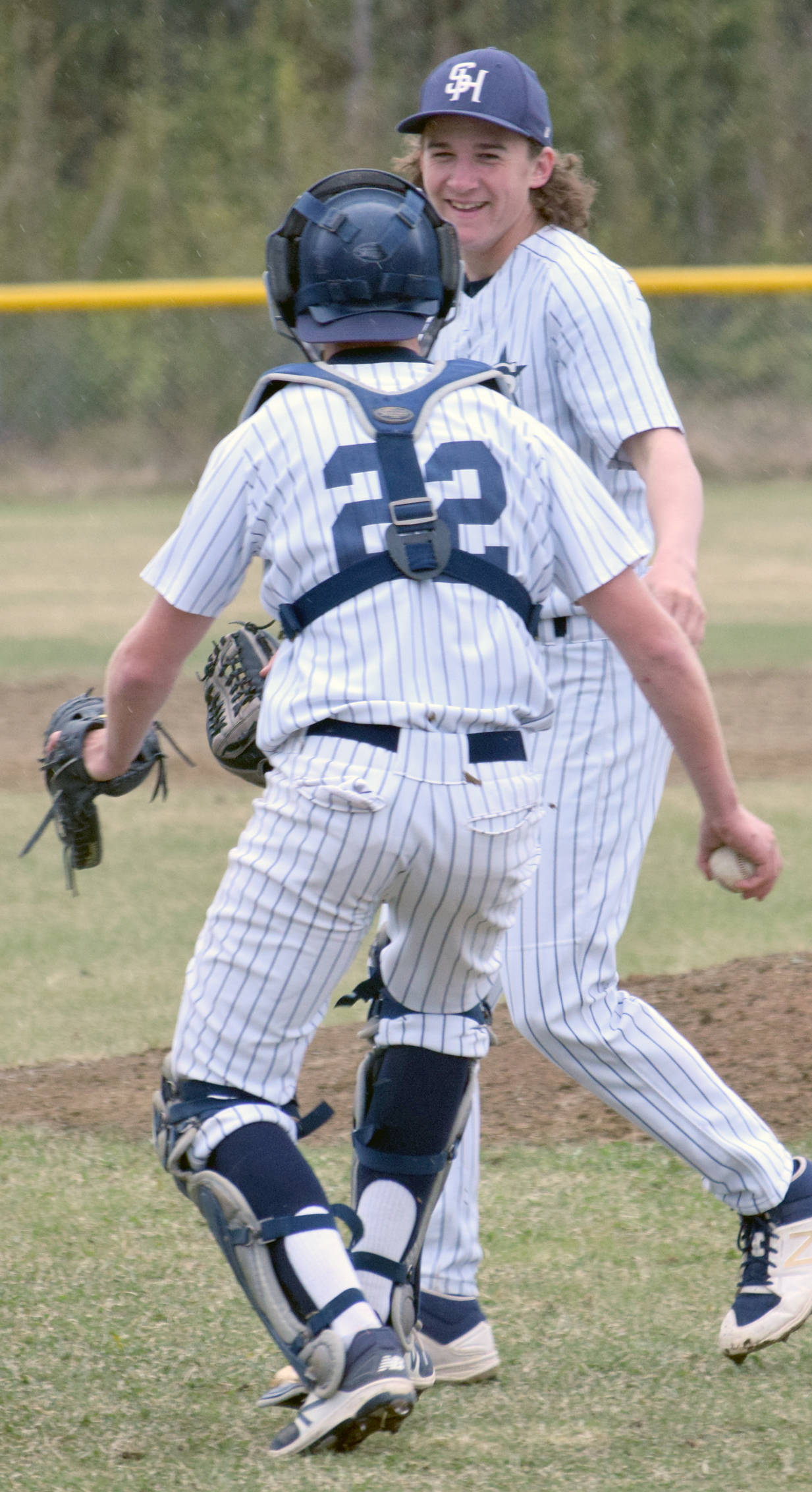 Soldotna catcher Cody Quelland congratulates Soldotna pitcher Matthew Daugherty on his no-hitter Wednesday, May 17, 2017, at the Soldotna Little League fields. (Photo by Jeff Helminiak/Peninsula Clarion)