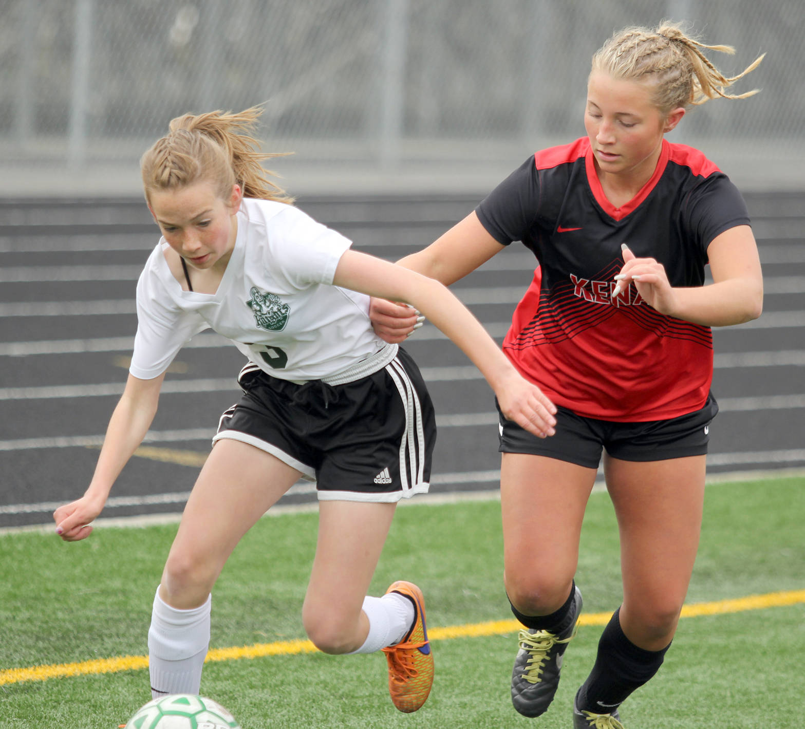 Kenai’s Annebelle Schneiders tries to move Colony freshman Myah Hoover off the ball during a 1-0 loss to Colony in the Northern Lights Conference semifinals Friday, May 19, 2017, at Colony High. (Photo by Jeremiah Bartz/Frontiersman.com)
