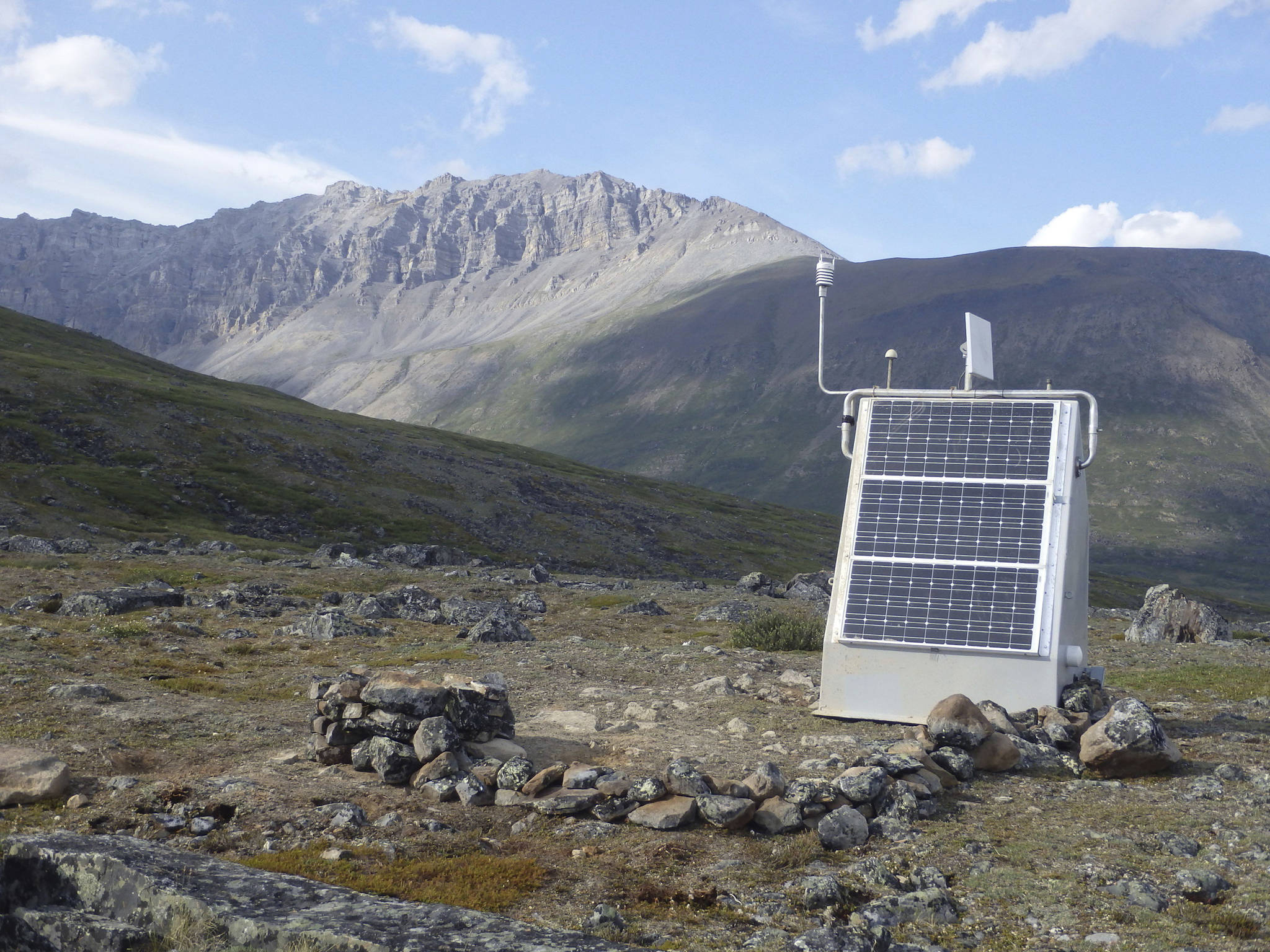 This undated photo provided by Incorporated Research Institutions for Seismology shows a seismic station installed at Anaktuvak Pass in Alaska’s Brooks Range. The station sends out earthquake information in real time. A seismometer rests at the bottom of a borehole and a fiberglass hut equipped with solar panels protects the station power system, electronics and radio telemetry equipment. (Incorporated Research Institutions for Seismology via AP)
