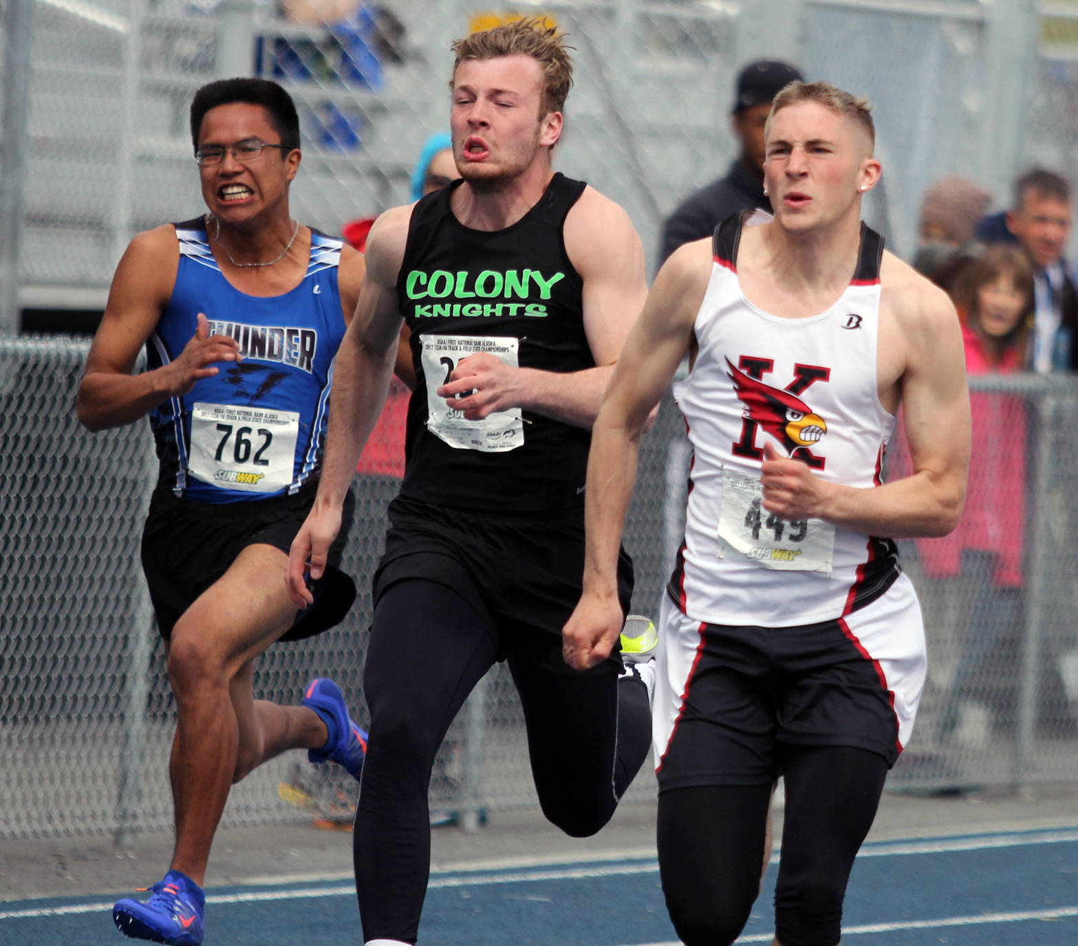 Kenai Central’s Josh Jackman, right, stays just ahead of Colony’s Jon Pomrenke during the boys’ 100 meters preliminaries on the first day of the ASAA/First National Bank State Track and Field Championships Friday at Palmer High School. (Photo by Jeremiah Bartz/Frontiersman.com)