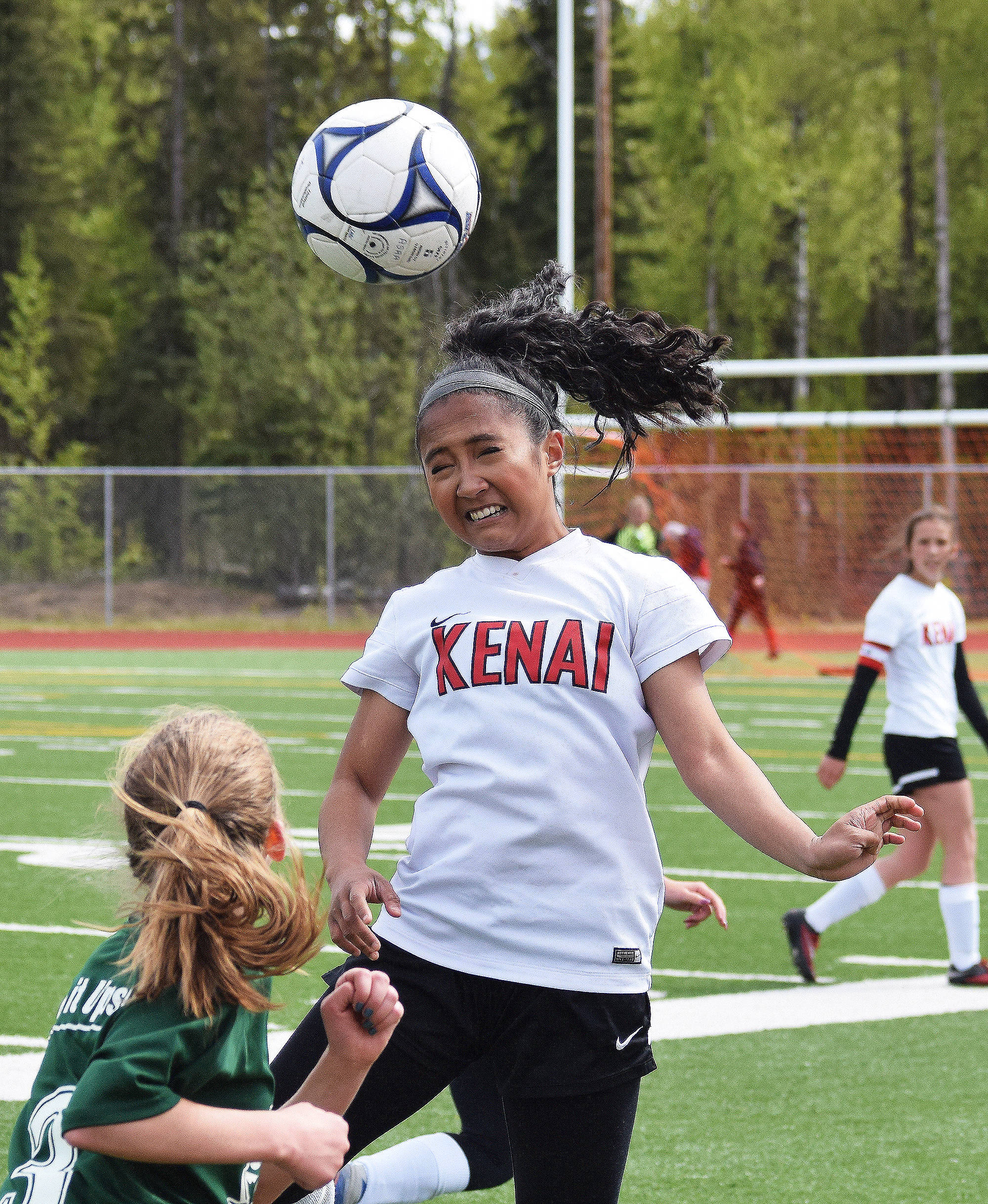 Kenai Central’s Paulyne Catacutan gets her head on a ball late in Friday’s consolation semifinal against Colony at the girls state soccer tournament at Eagle River High School. (Photo by Joey Klecka/Peninsula Clarion)