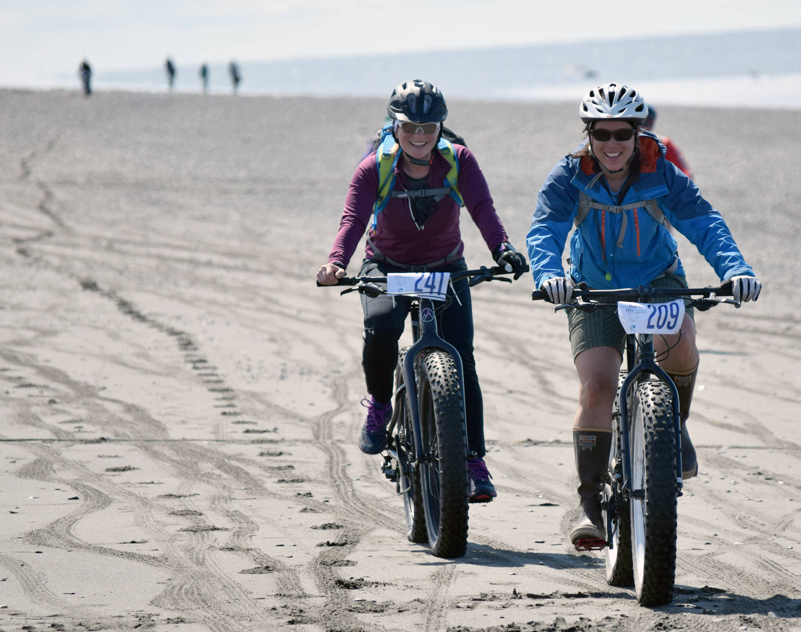 Morgan Aldridge and Mary Simondsen approach the end of the 10-mile bike ride at the Mouth to Mouth Wild Run and Ride on Monday, May 29, 2017. (Photo by Jeff Helminak/Peninsula Clarion)