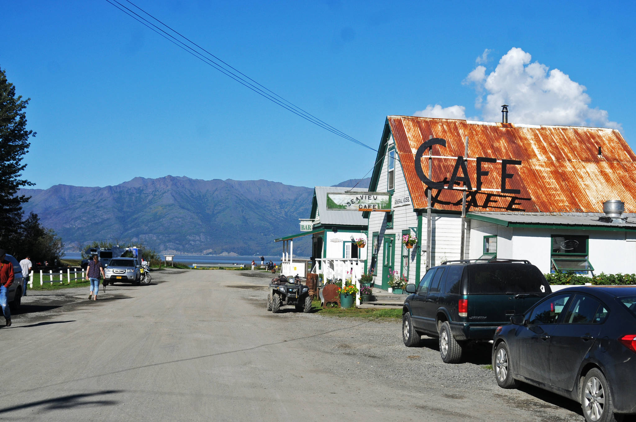 In this August 2016 photo, people walk along the main historic downtown street of Hope, Alaska. Hope, a small unincorporated town along the Turnagain Arm at the end of the 18-mile Hope Highway, is a popular tourist destination in the summer months for its hiking and boating opportunities and for its historical value. (Elizabeth Earl/Peninsula Clarion, file)  In this August 2016 photo, people walk along the main historic downtown street of Hope. Hope, a small unincorporated town along the Turnagain Arm at the end of the 18-mile Hope Highway, is a popular tourist destination in the summer months for its hiking and boating opportunities and for its historical value. (Elizabeth Earl/Peninsula Clarion, file)