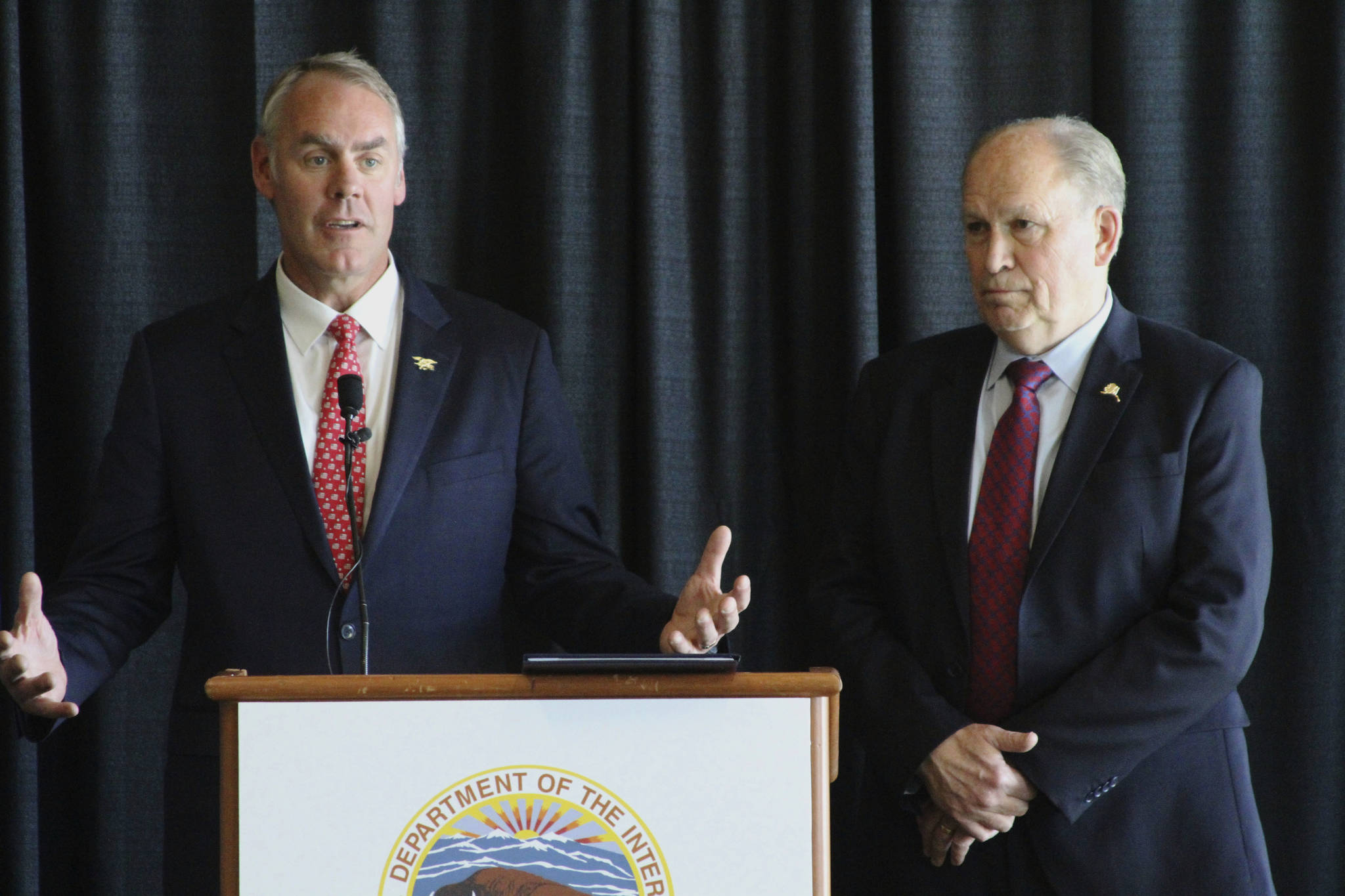 Interior Secretary Ryan Zinke, left, with Alaska Gov. Bill Walker, speaks during a news conference Wednesday, May 31, 2017, in Anchorage, Alaska. Zinke announced steps during a speech earlier in the day that could lead to expanded petroleum drilling in two areas of northern Alaska where environmental groups want protections for wildlife. (AP Photo/Mark Thiessen)