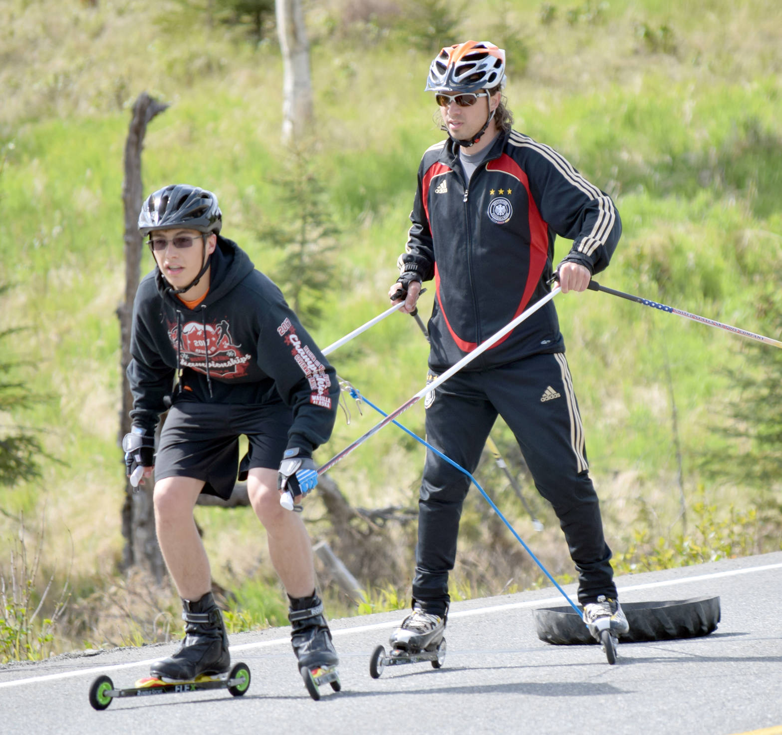 Bradley Walters, a sophomore at Soldotna High School, receives instruction from Andy Liebner on poling technique Monday, June 5, 2017, on South Cohoe Loop. (Photo by Jeff Helminiak/Peninsula Clarion)