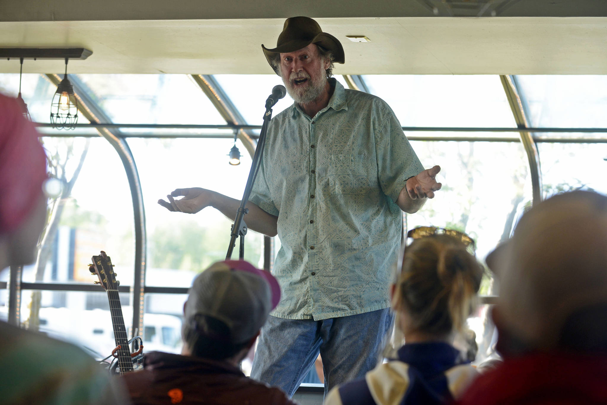 Bill Holt tells a fishing tale at Odie’s Deli on Friday, June 2, 2017 in Soldotna, Alaska. Holt was among the seven storytellers in the latest session of True Tales Told Live, an ocassional storytelling event cofounded by Pegge Erkeneff, Jenny Nyman, and Kaitlin Vadla. (Ben Boettger/Peninsula Clarion)