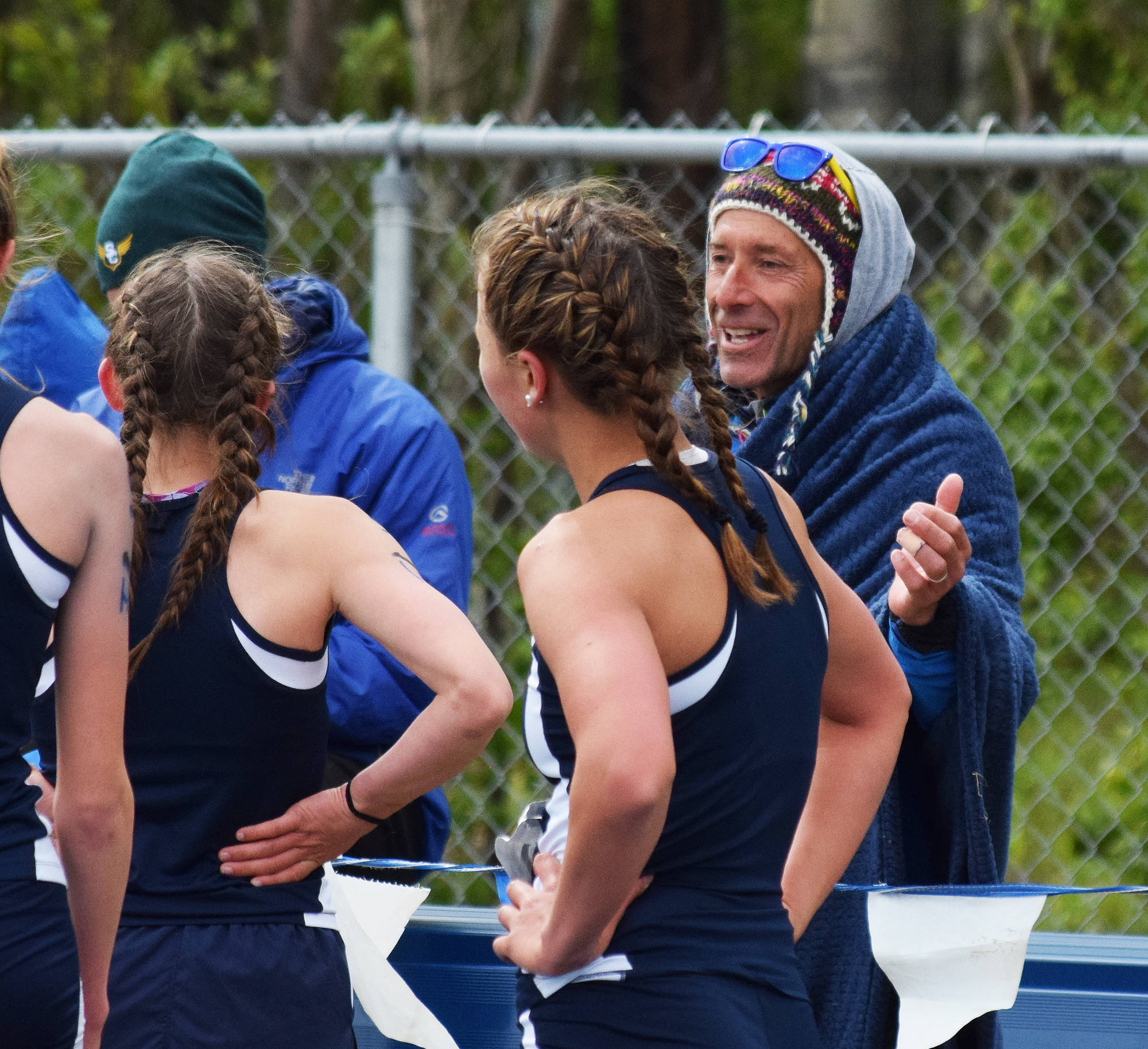 Homer head track & field coach Bill Steyer congratulates his girls relay team after a victory at the Class 1-2-3A state meet May 27 at Palmer High School. Steyer recently stepped down as head coach of the Homer cross-country and track teams after a successful seven-year run that netted the Mariners five state titles. (Photo by Joey Klecka/Peninsula Clarion)
