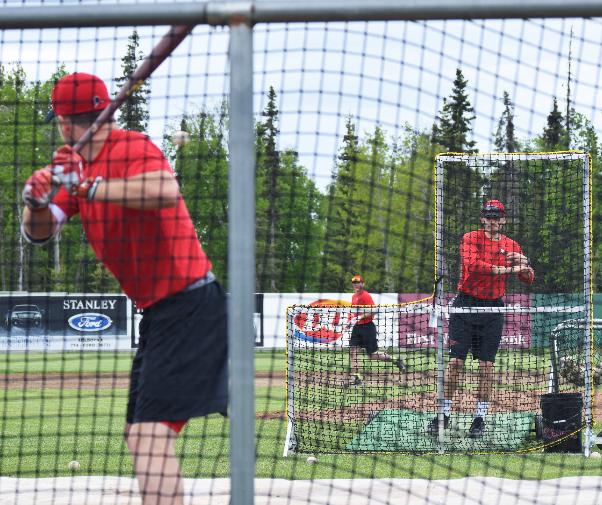 The Peninsula Oilers practice hitting Thursday afternoon at Coral Seymour Memorial Ballpark in Kenai. (Photo by Joey Klecka/Peninsula Clarion)