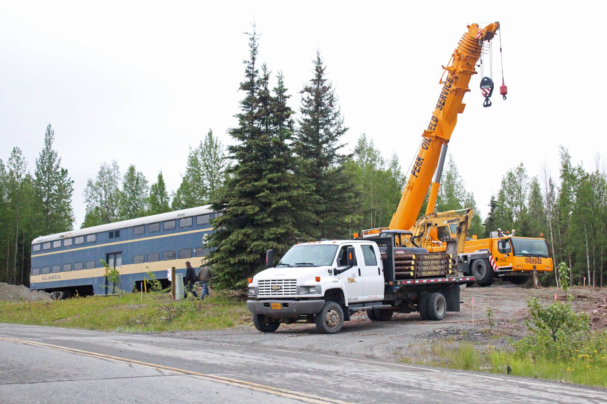Rail car 602, previously of the Alaska Railroad, is trucked up a hill toward Kleeb Loop on Saturday, June 3, 2017 in Soldotna, Alaska. The rail car was purchased by Mary Krull along with another car from South Dakota to be turned into a coffee house and beer and wine bar/restaurant, hopefully by next year. (Megan Pacer/Peninsula Clarion)