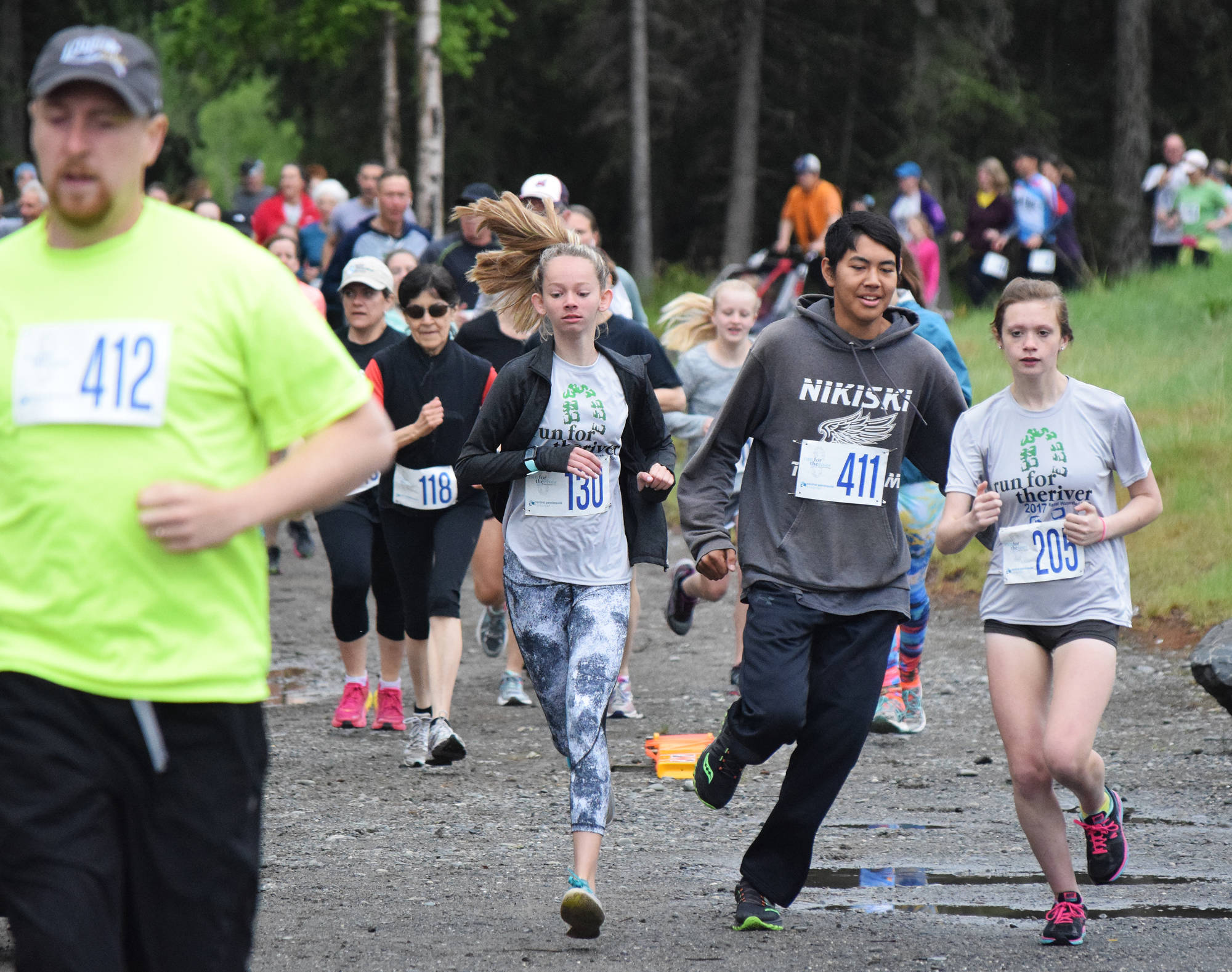 The field of runners in the Run for the River 5-kilometer race race out onto the course Saturday morning in Soldotna. (Photo by Joey Klecka/Peninsula Clarion)