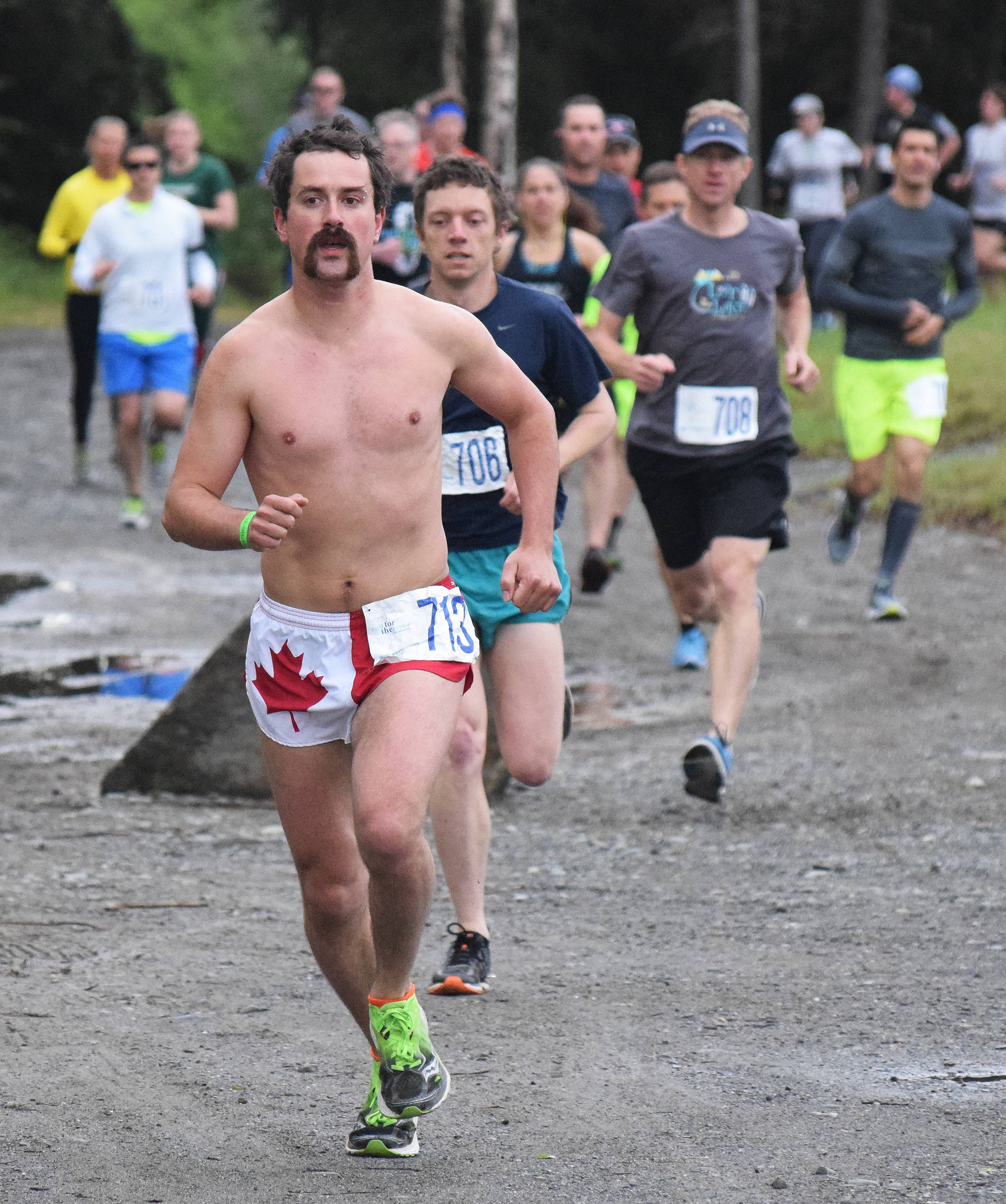 Men’s Run for the River 10-mile winner Matt Adams leads the pack out onto the course Saturday morning in Soldotna. (Photo by Joey Klecka/Peninsula Clarion)