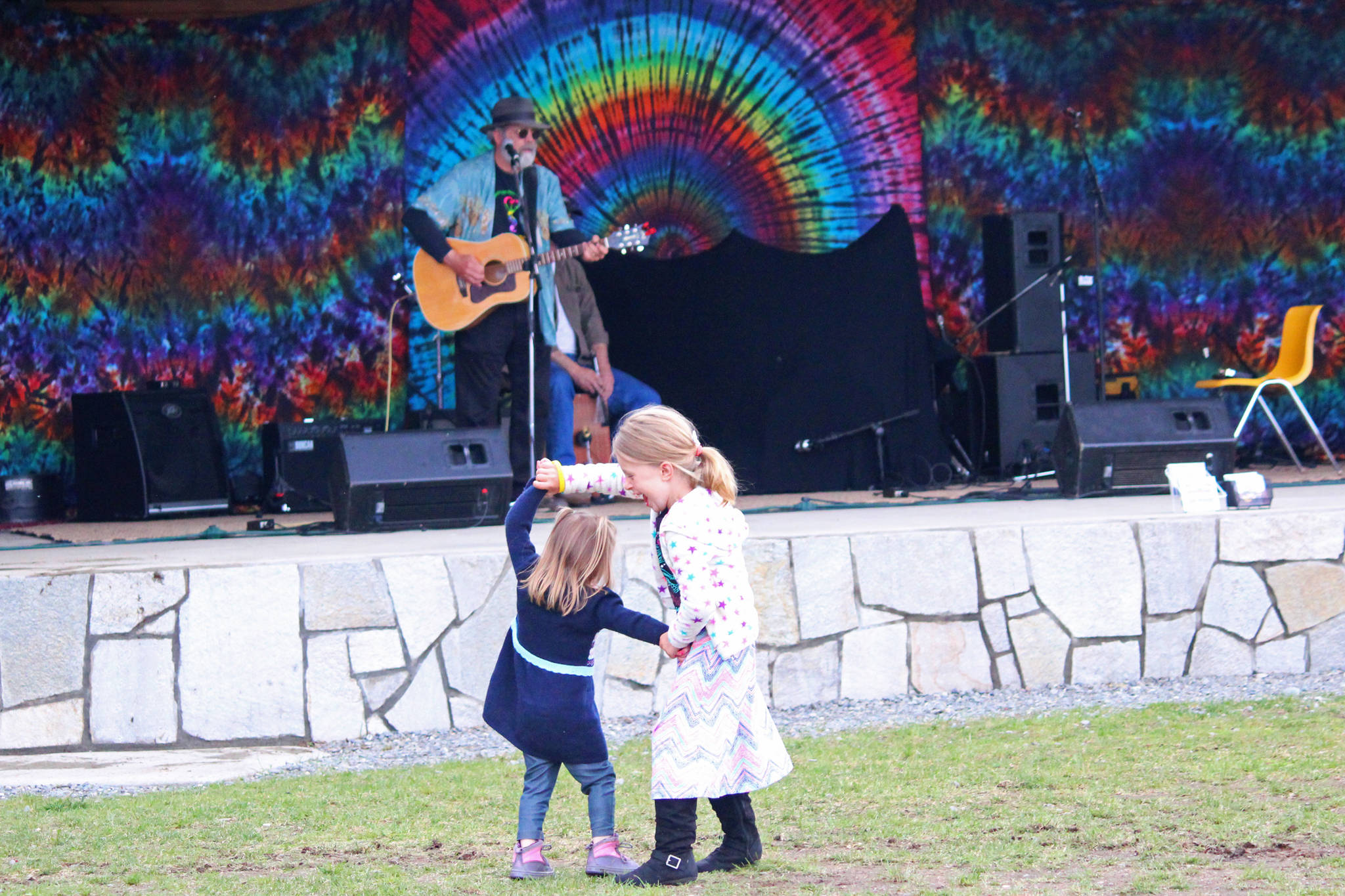 Graysen Besse, 5, gives Bensen Besse, 2, a twirl while dancing during this year’s Kenai River Festival on Saturday, June 10, 2017 at Soldotna Creek Park in Soldotna, Alaska. (Megan Pacer/Peninsula Clarion)