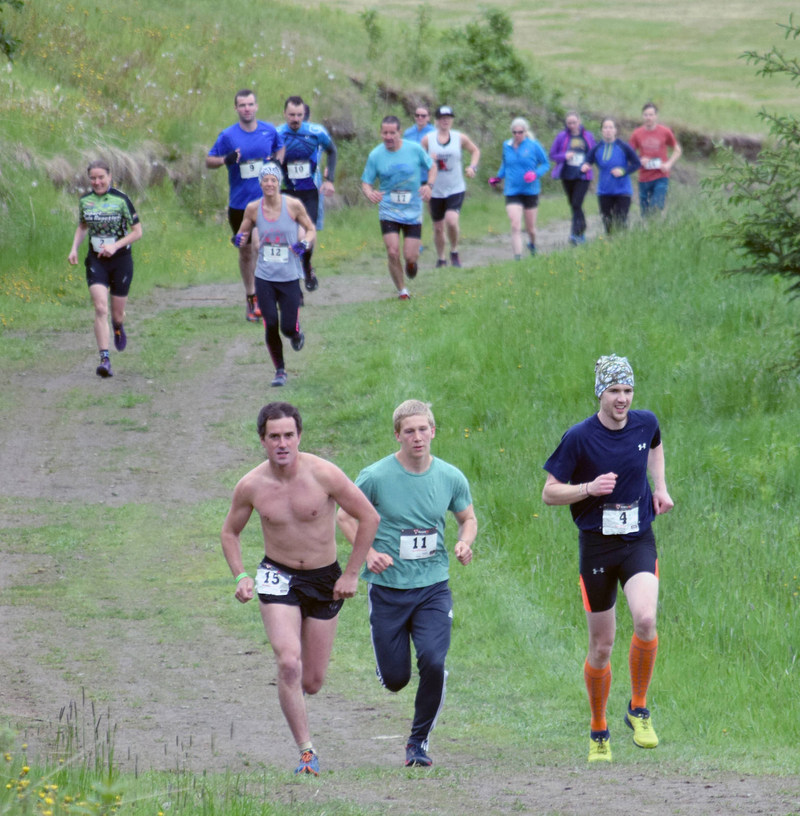 Matt Adams, Karl Danielson and Brian Beeson lead the field at the start of the Snippit Loppet Duathlon on Sunday, June 11, 2017, at Tsalteshi Trails. (Photo by Jeff Helminiak/Peninsula Clarion)