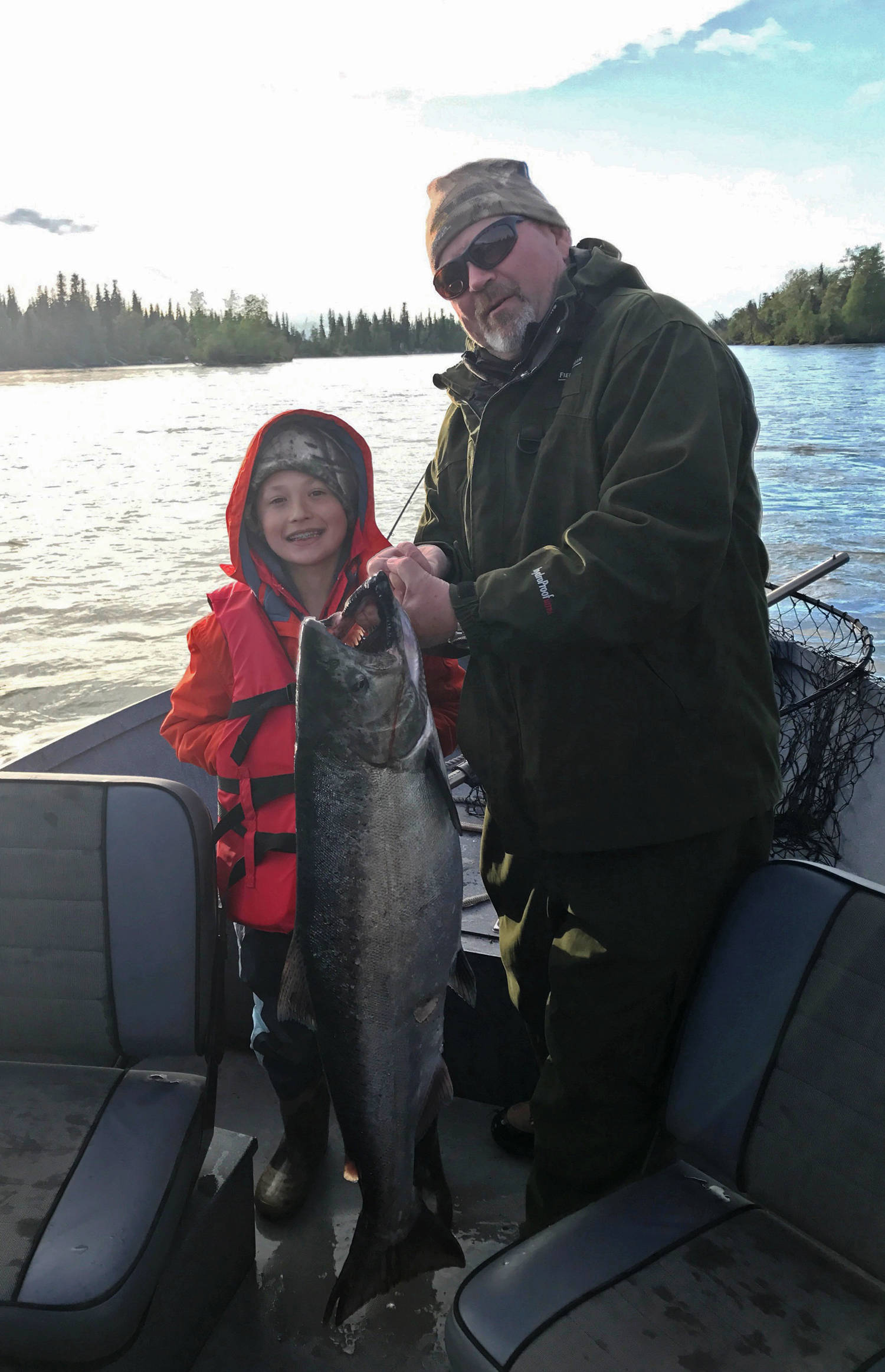 Randy McPherson and his grandson Ethan, 9, both of Wisconsin, show off their Kenai River king salmon caught Tuesday, June 13, 2017. Kenai River early-run kings have been returning in larger numbers this year as compared to the last several years, leading the Alaska Department of Fish and Game to liberalize the maximum size limit for retention from 36 inches to 46 inches on Monday. (Photo courtesy Jason Foster)