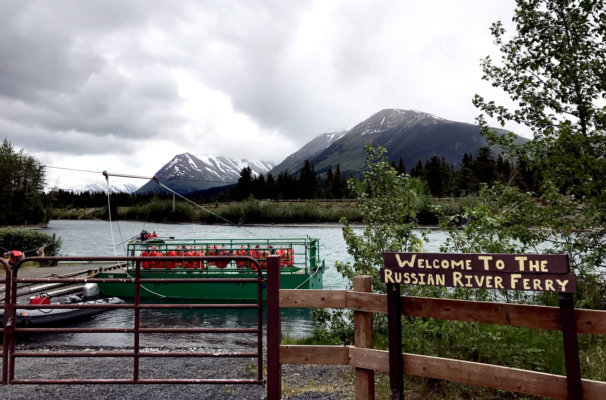 The Russian River Ferry waits, ready to bring fisherman to the opposite bank of the upper Kenai River, on the river’s opening day of fishing for sockeye salmon on Sunday, June 11, 2017 in Cooper Landing, Alaska. (Photo by Kat Sorensen/Peninsula Clarion)