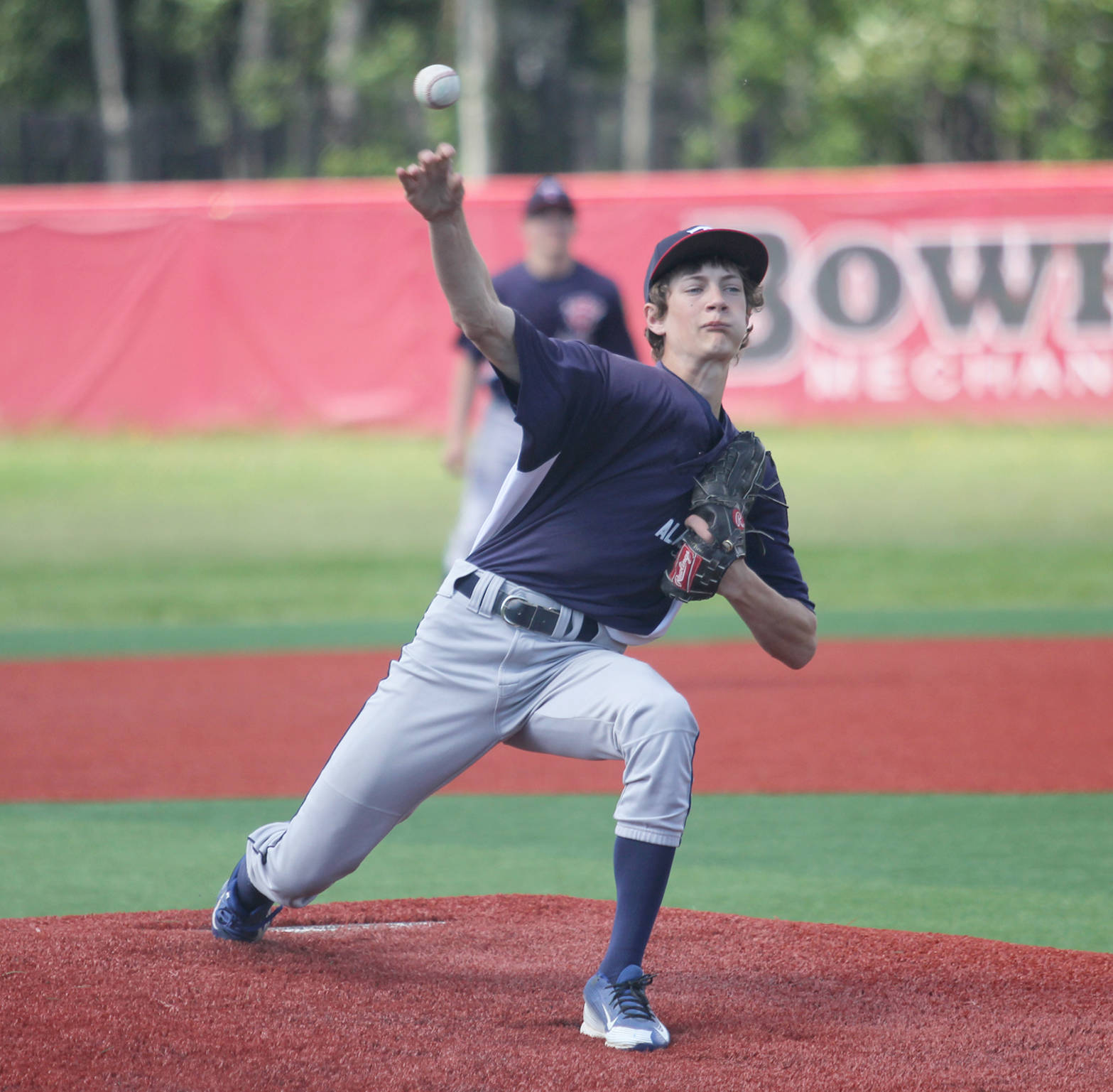 Kenai’s David Belger releases a pitch during a 13-3 loss to Wasilla on Wednesday, June 14, 2017, in Wasilla. (Photo by Jeremiah Bartz/Frontiersman)