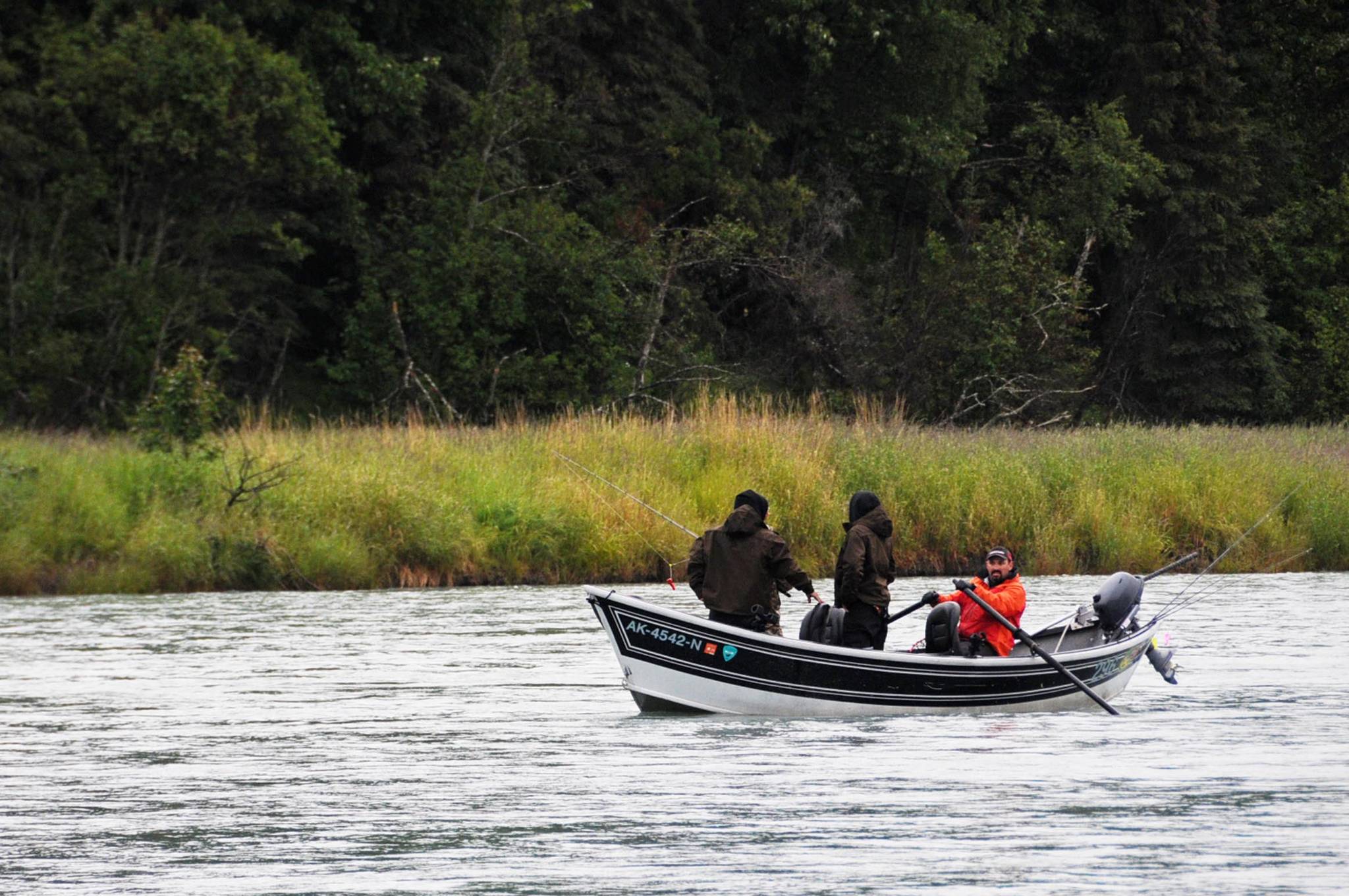In this June 2016 photo, a guide rows clients on the Kasilof River near the confluence with Crooked Creek in Kasilof, Alaska. (Photo by Elizabeth Earl/Peninsula Clarion, file)