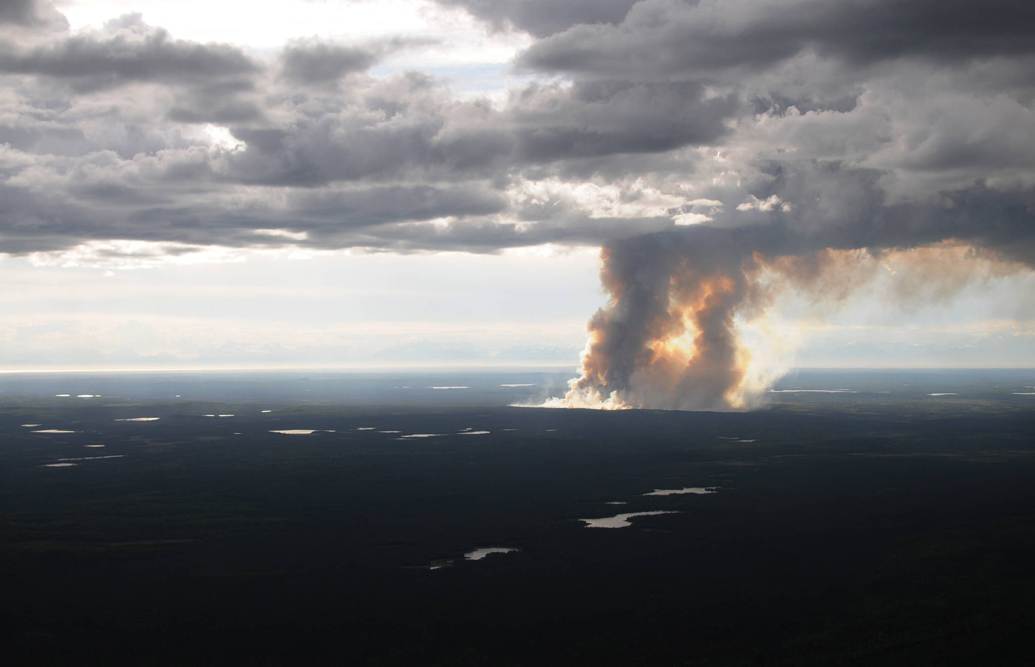 Smoke rises from the burn area of the East Fork Fire on the Kenai National Wildlife Refuge on Friday, June 16, 2017 near Sterling, Alaska. The fire, sparked by dry lightning, had burned about 850 acres by Friday night. (Photo by Elizabeth Earl/Peninsula Clarion)