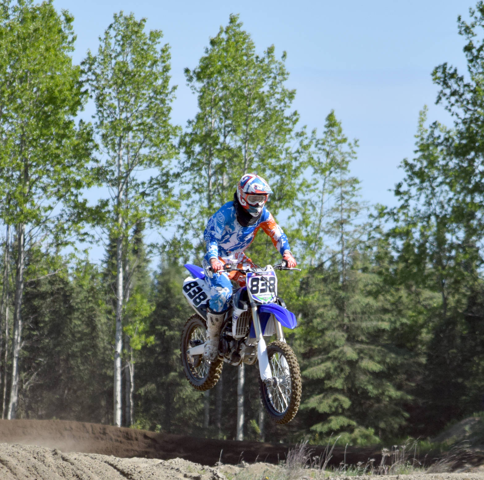 Kenai’s Cole Crandall soars through the air Saturday, June 17, 2017, at the Alaska State Motocross Championships at Twin City Raceway in Kenai. (Photo by Jeff Helminiak/Peninsula Clarion)