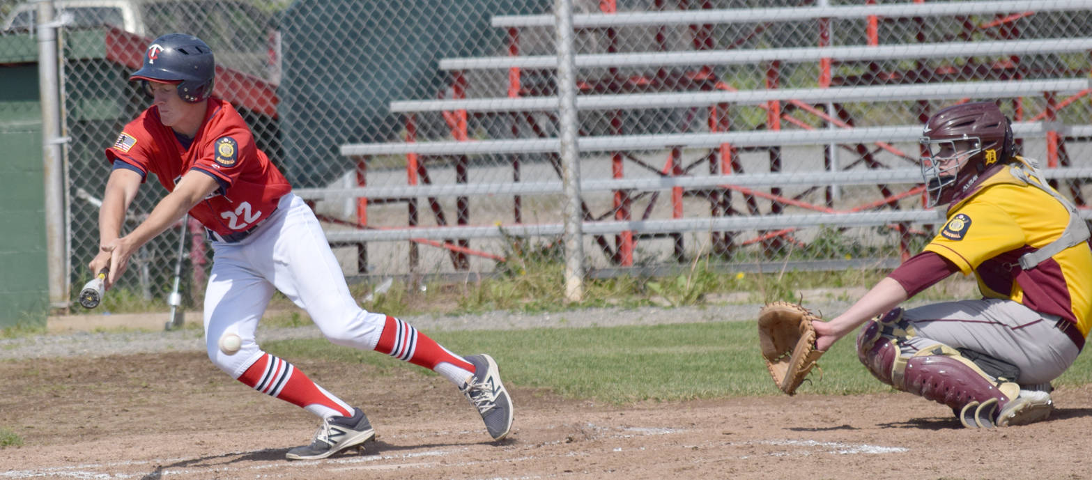 Twins’ Cody Quelland bunts foul in the first game of a doubleheader against Dimond on Saturday, June 17, 2017, at Coral Seymour Memorial Ballpark in Kenai. (Photo by Jeff Helminiak/Peninsula Clarion)