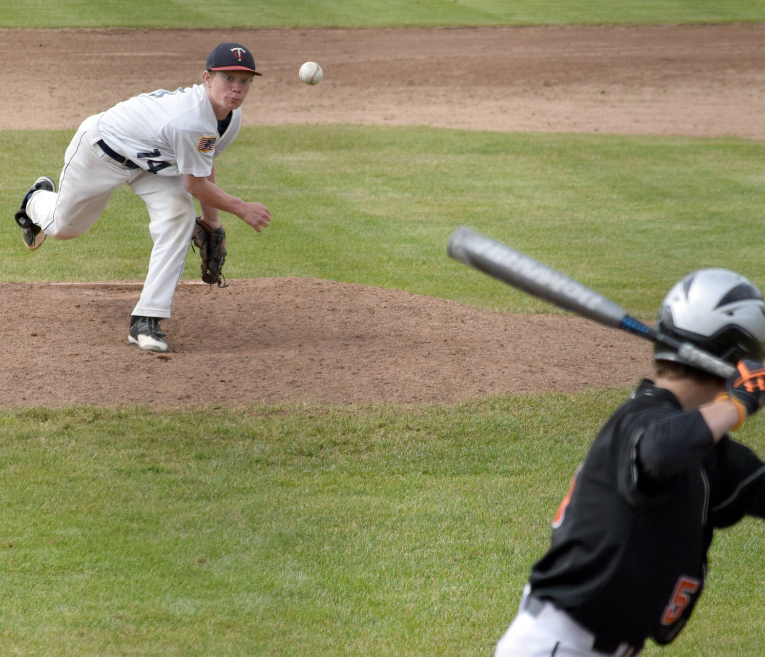Twins starting pitcher Mose Hayes delivers home against West on Sunday, June 18, 2017, at Coral Seymour Memorial Park in Kenai. (Photo by Jeff Helminiak/Peninsula Clarion)