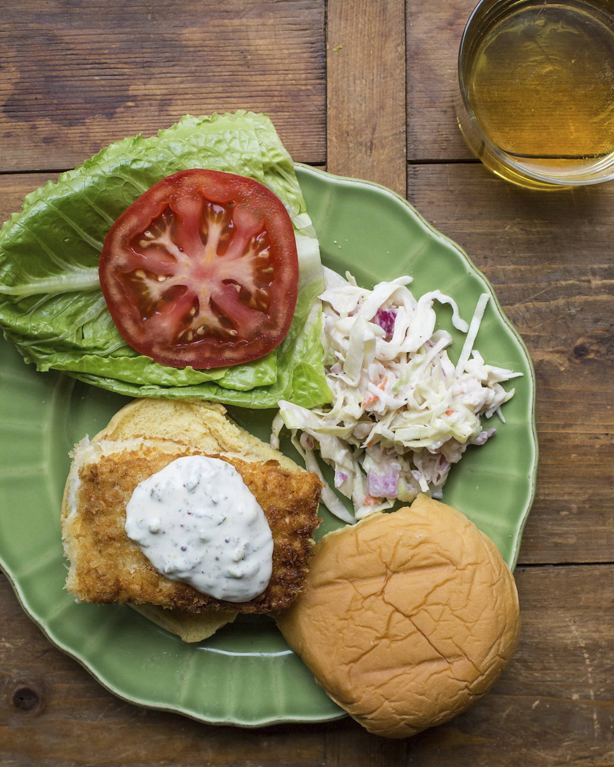 This April 6 photo shows a fried halibut fish sandwich in New York. This dish is from a recipe by Katie Workman. (Sarah E Crowder/Katie Workman via AP)