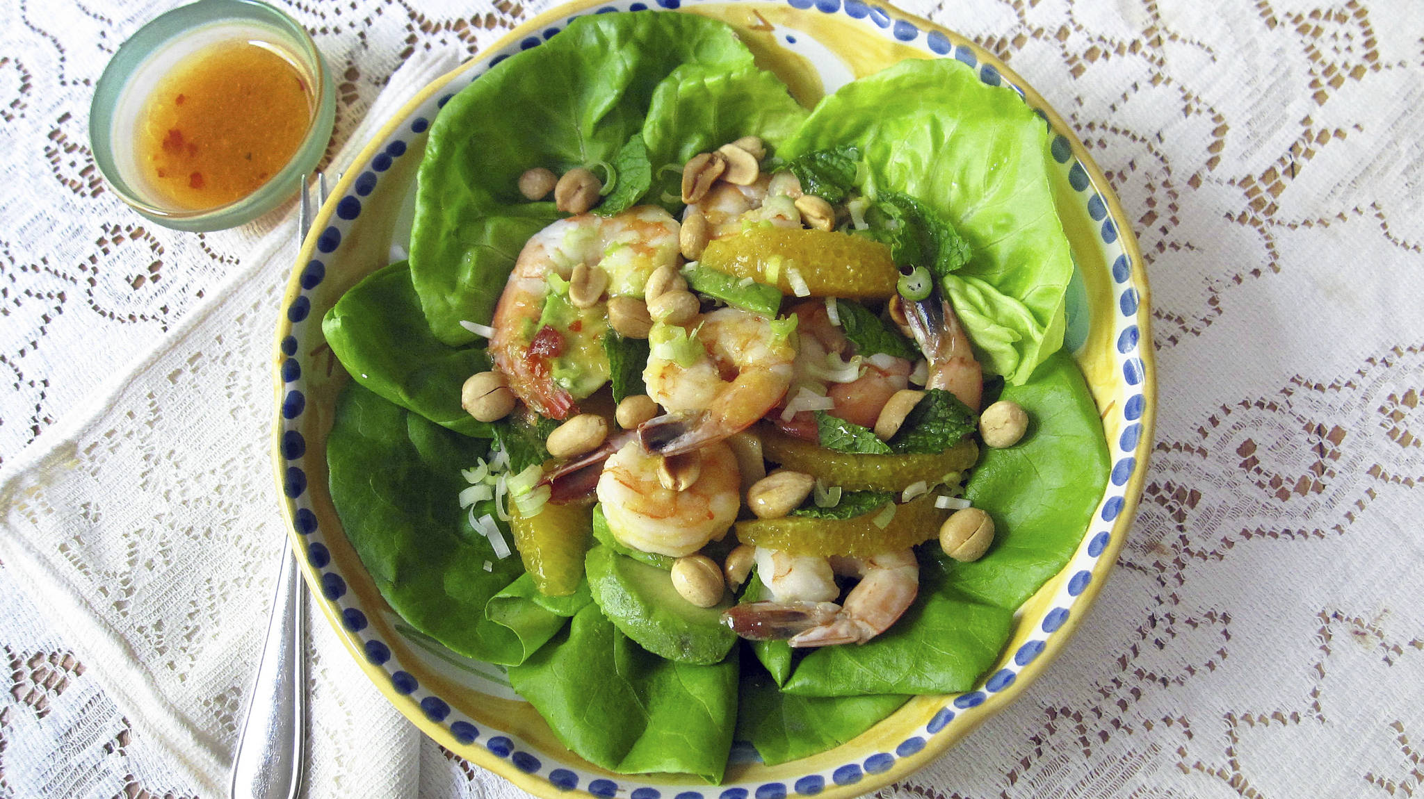 This June 15 photo shows a shrimp, avocado and orange salad with spicy orange dressing in New York. This dish is from a recipe by Sara Moulton. (Sara Moulton via AP)