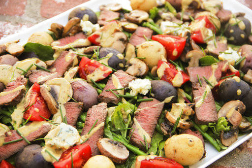 This June 12, 2017 photo shows a meat and potatoes steakhouse salad in Coronado, Calif. This dish is from a recipe by Melissa d’Arabian. (Melissa d’Arabian via AP)