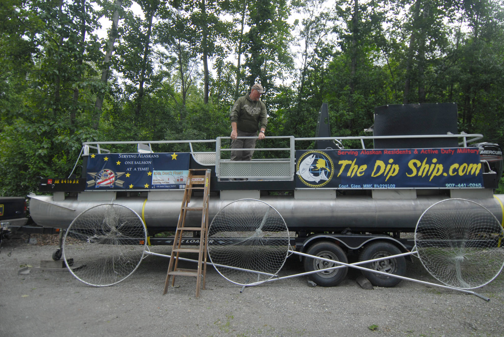 Star photo by Matt Tunseth Glen Trombley stands aboard his pontoon boat “The Dip Ship” outside his home in Peters Creek, Alaska on Monday, June 19, 2017. Trombley and his son, Kody, will operate the boat this summer in the Kenai River personal use salmon fishery.