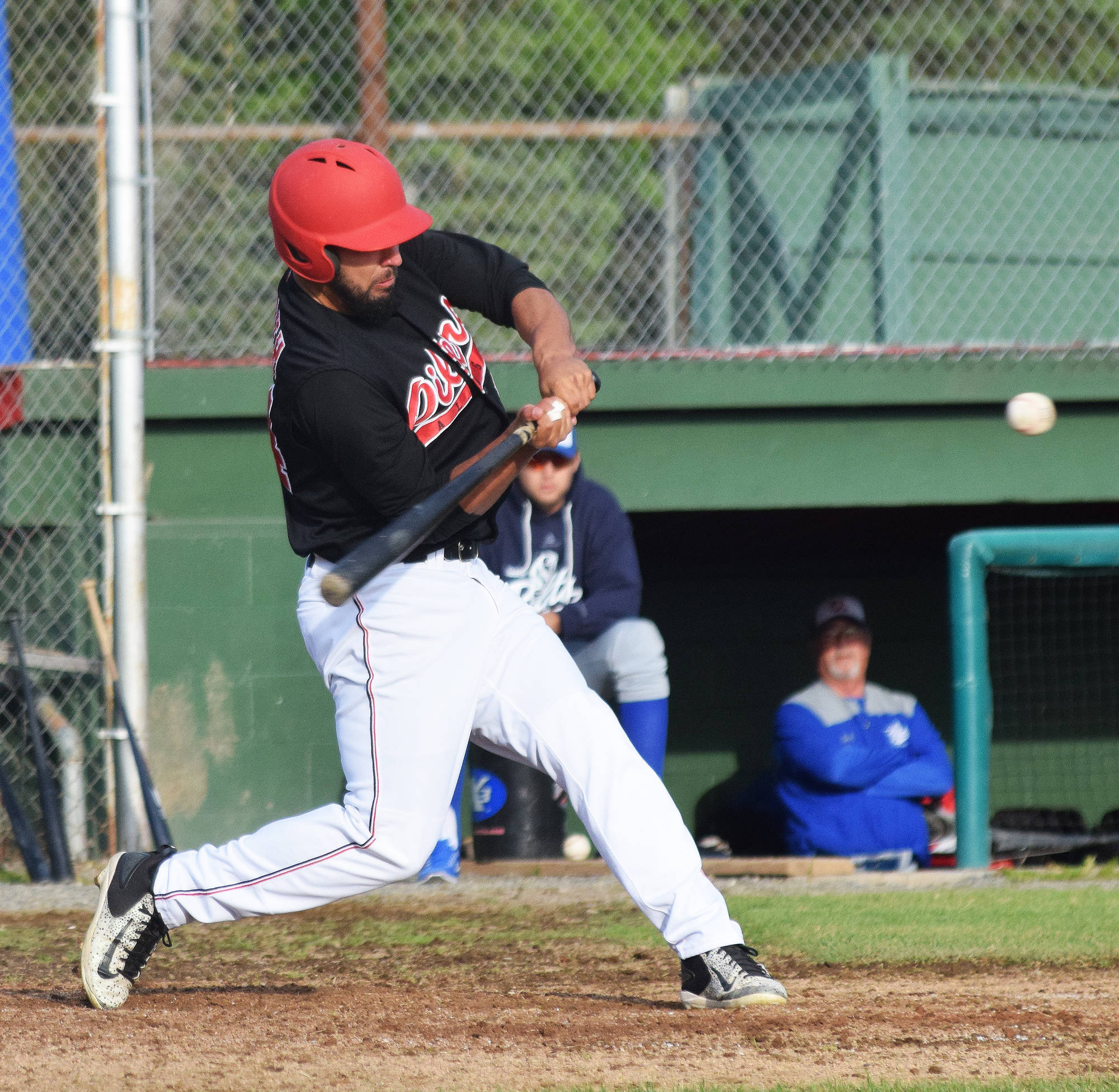 Ryan Smith of the Peninsula Oilers swings at a pitch from the Anchorage Glacier Pilots, Friday, June 24, 2017, at Coral Seymour Memorial Park. (Photo by Joey Klecka/Peninsula Clarion)