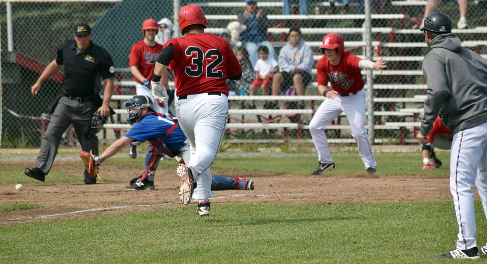Glacier Pilots catcher Carter Bins prepares to collect the ball and swipe a successful tag on Jeremy Conant of the Oilers on Sunday, June 25, 2017, at Coral Seymour Memorial Park in Kenai. While Conant was out, Kellen Strahm (22) and Oliver Dunn had scored before him to provide the difference in a 2-1 victory. (Photo by Jeff Helminiak/Peninsula Clarion)