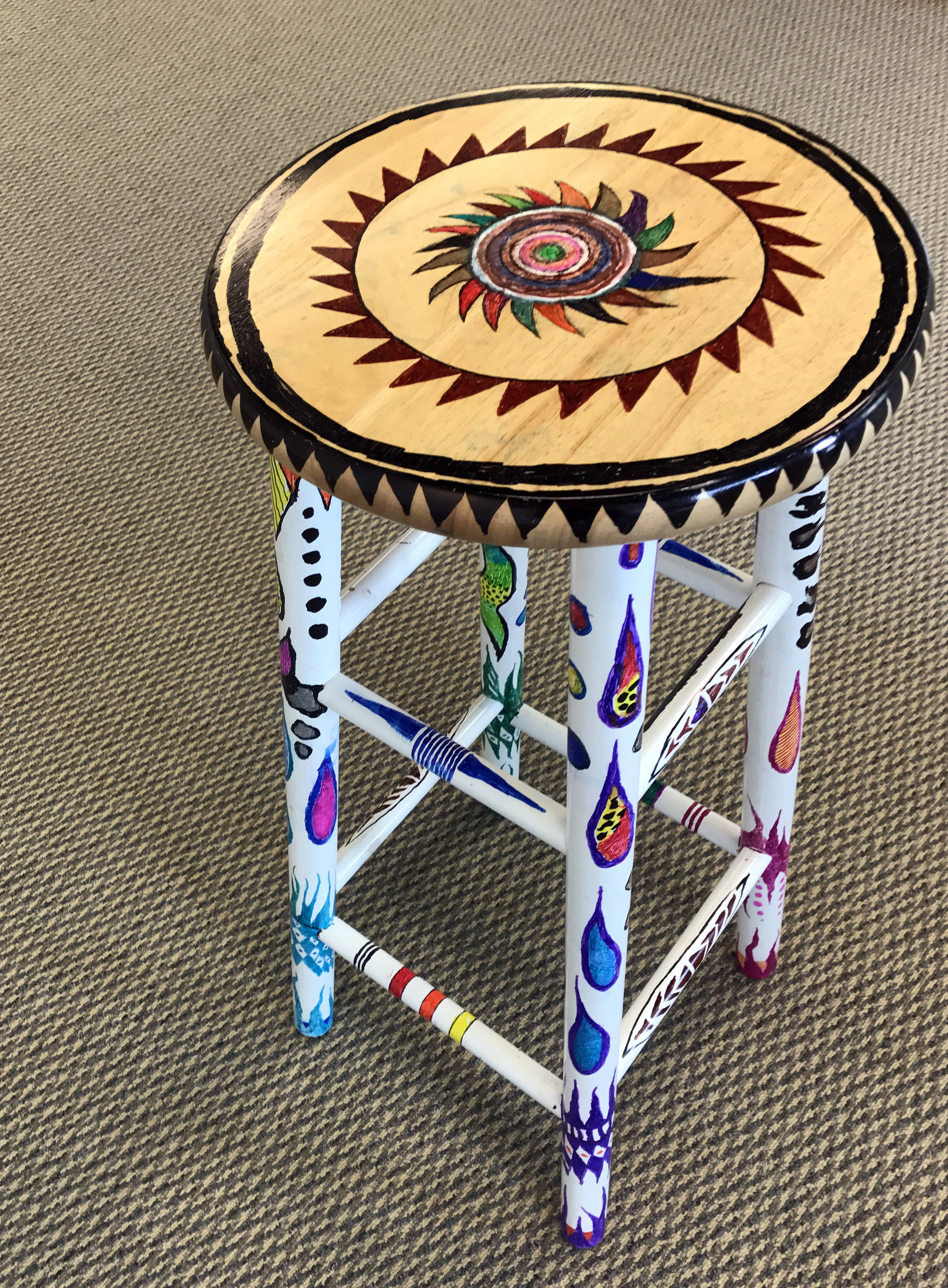 Robert Range of Kenai donated a decorated stool to be auctioned off at the Kenai Fine Art Center’s Annual Harvest Auction, to be held September 30, 2017 in Kenai, Alaska. The stool was created using permanent markers. (Photo by Kat Sorensen/Peninsula Clarion)