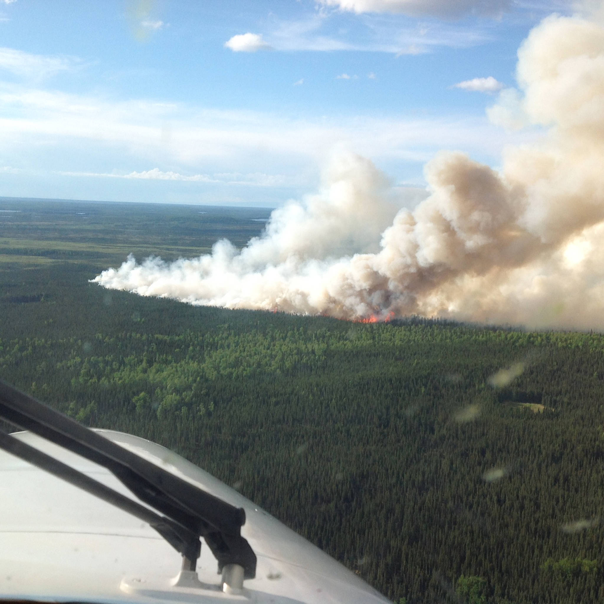 The Swan Lake wildfire burns in the Kenai National Wildlife Refuge as seen from the air June 15, 2017 near Sterling, Alaska. The 1,016-acre fire started by lightning will continue to be monitored, though it is not threatening any residents and has been downgraded in intensity. (Photo courtesy Tim Mowry, Alaska Division of Forestry)