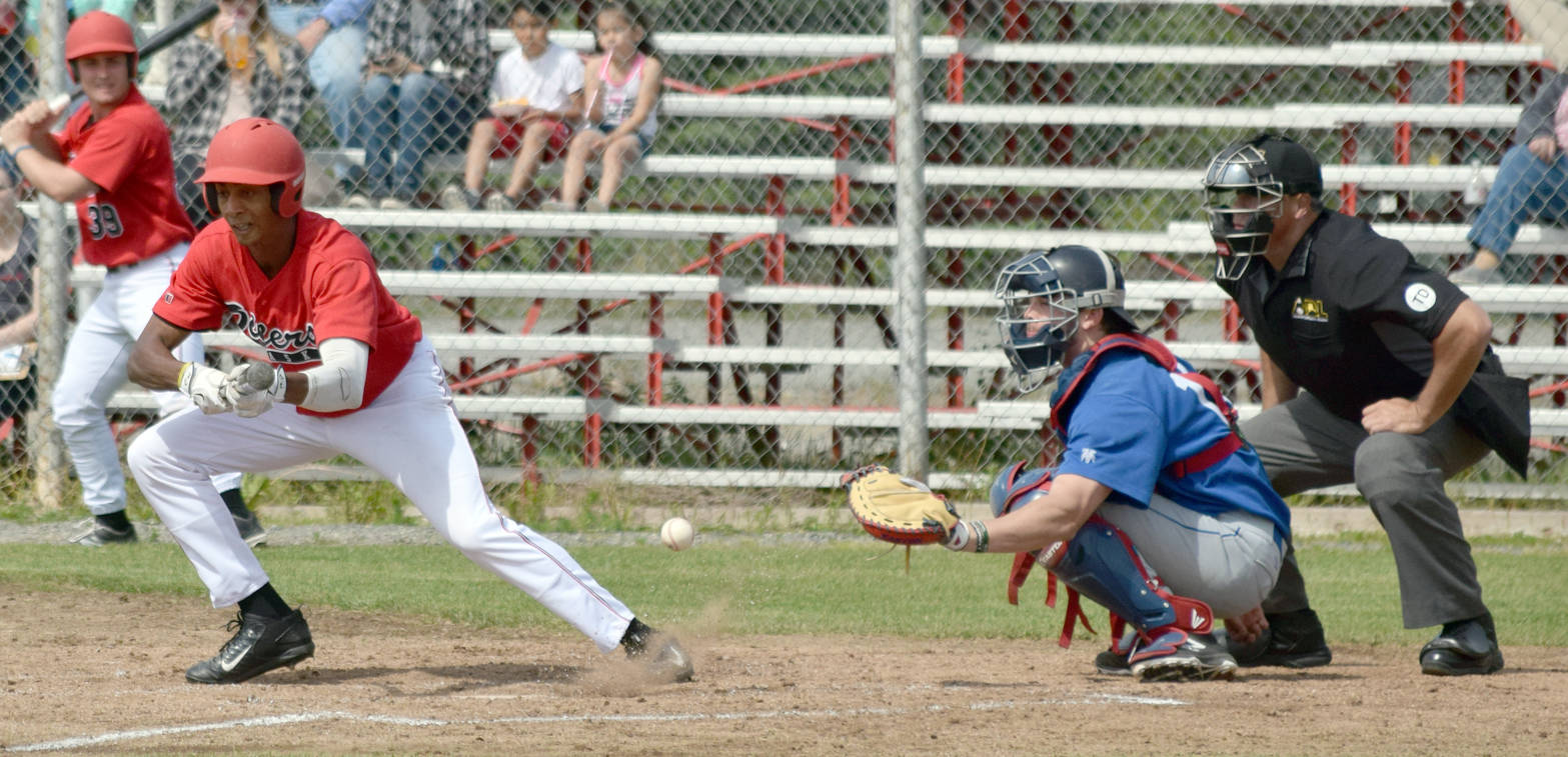 Raymond Kerr drags a bunt foul Sunday, June 25, 2017, against the Anchorage Glacier Pilots at Coral Seymour Memorial Park in Kenai. (Photo by Jeff Helminiak/Peninsula Clarion)