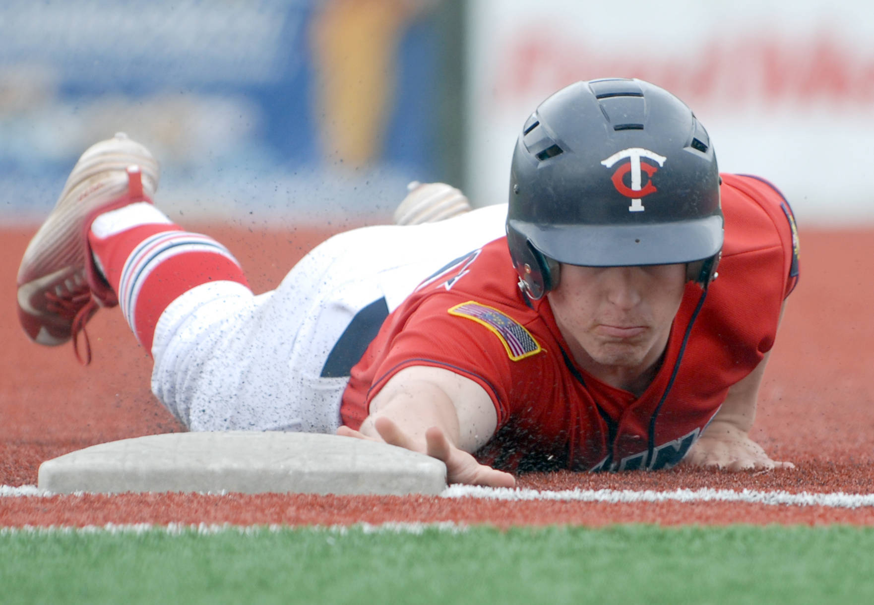 Kenai’s Paul Steffensen dives back into first base during the second game of an Alaska American Legion Baseball doubleheader between Kenai Post 20 and Eagle River on Saturday, July 1, 2017 at the Loretta French Sports Complex in Chugiak. Eagle River won 11-6. (Photo by Matt Tunseth/Chugiak-Eagle River Star)